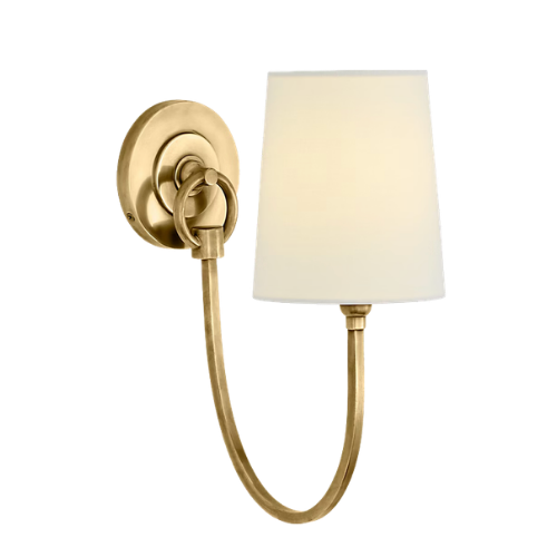 A wall-mounted gold-colored sconce with a curved arm and a white lampshade.