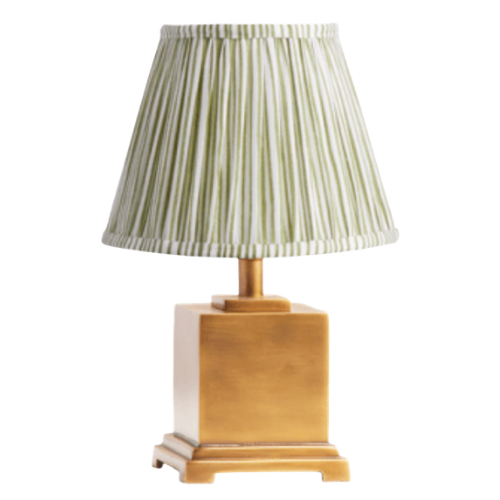 Table lamp with a beige wooden base and a pleated green and white striped lampshade.