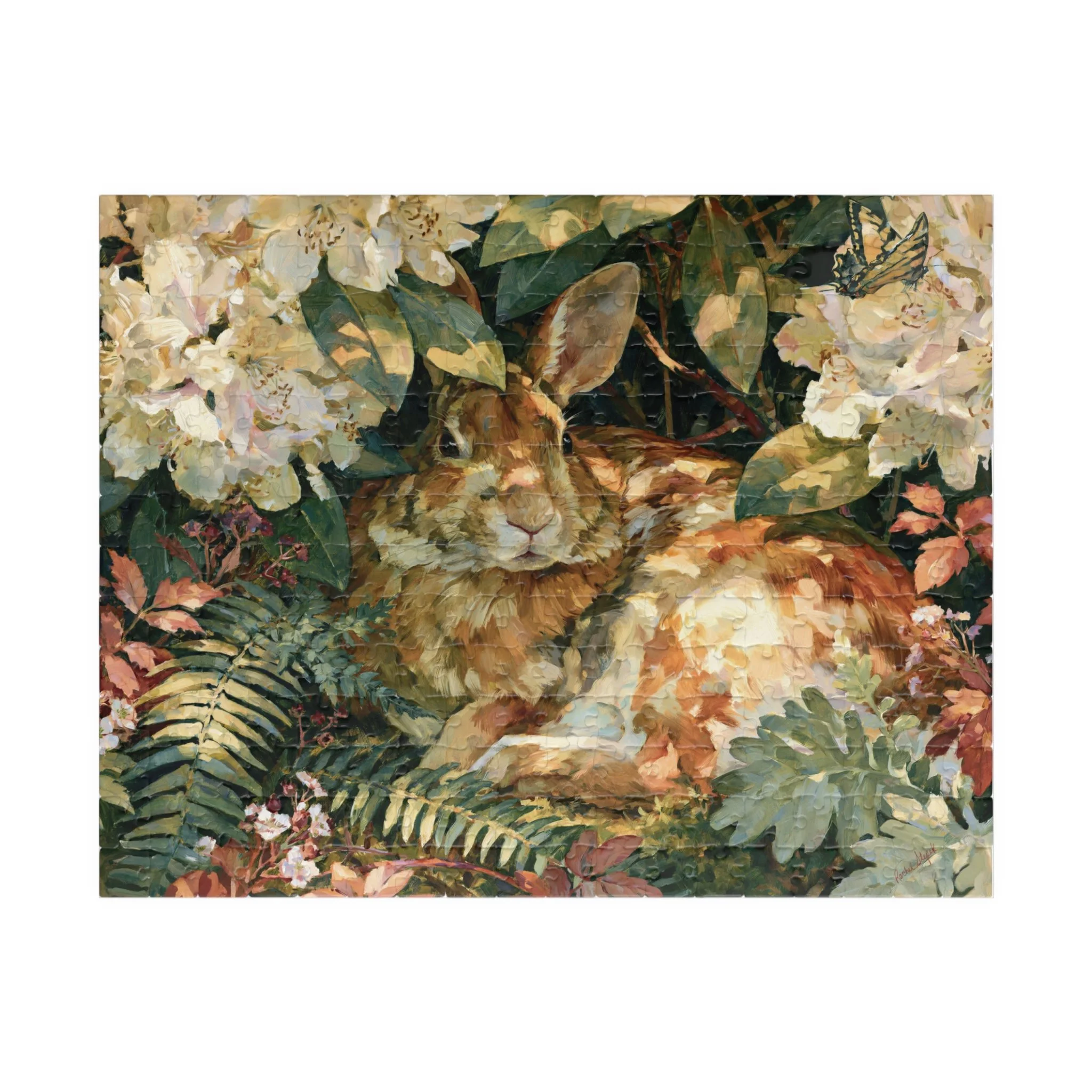 Rabbit in the Rhododendron puzzle front artwork featuring an Eastern cottontail resting among rhododendron blooms, ferns, moss, and soft woodland leaves