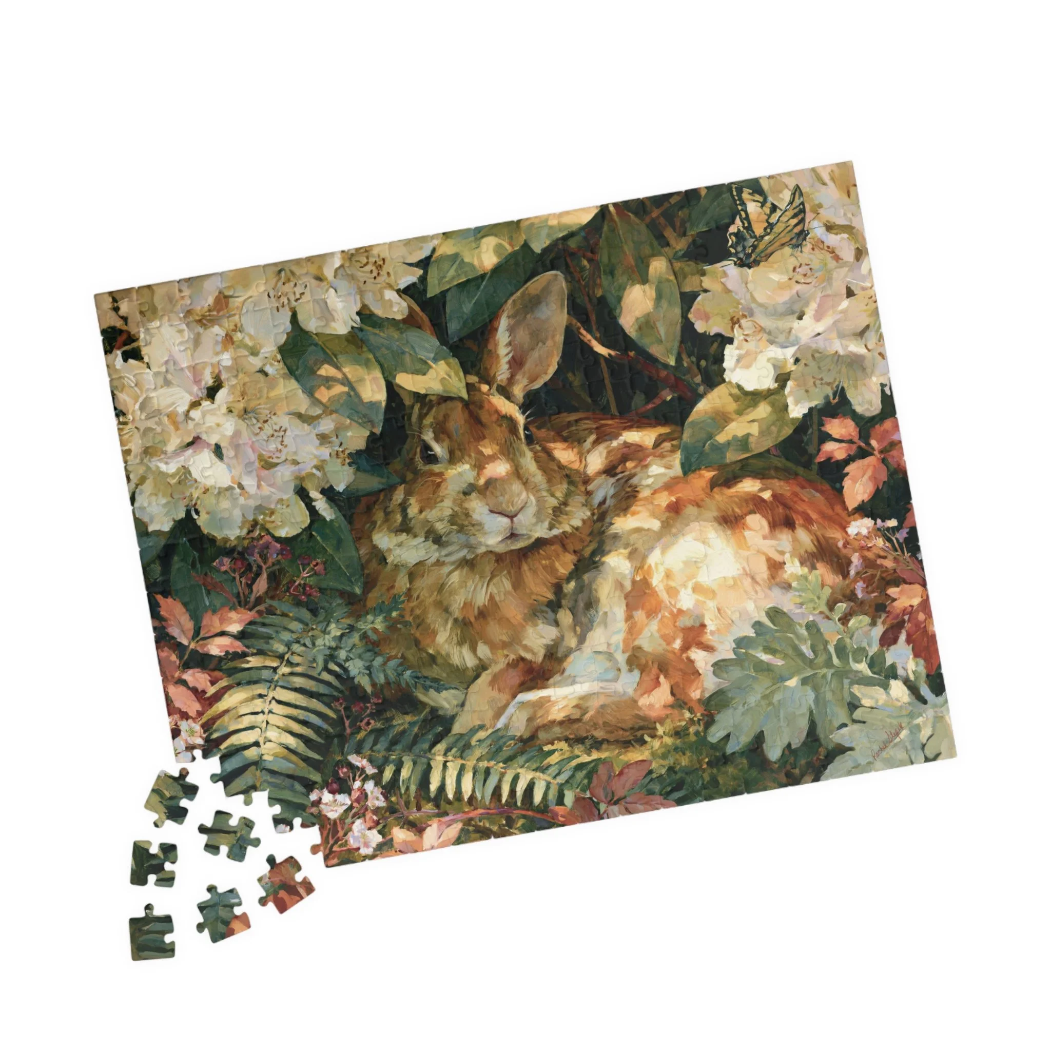 Rabbit in the Rhododendron jigsaw puzzle with original Lakehouse artwork of an Eastern cottontail hidden in rhododendron, ferns, moss, and warm woodland light