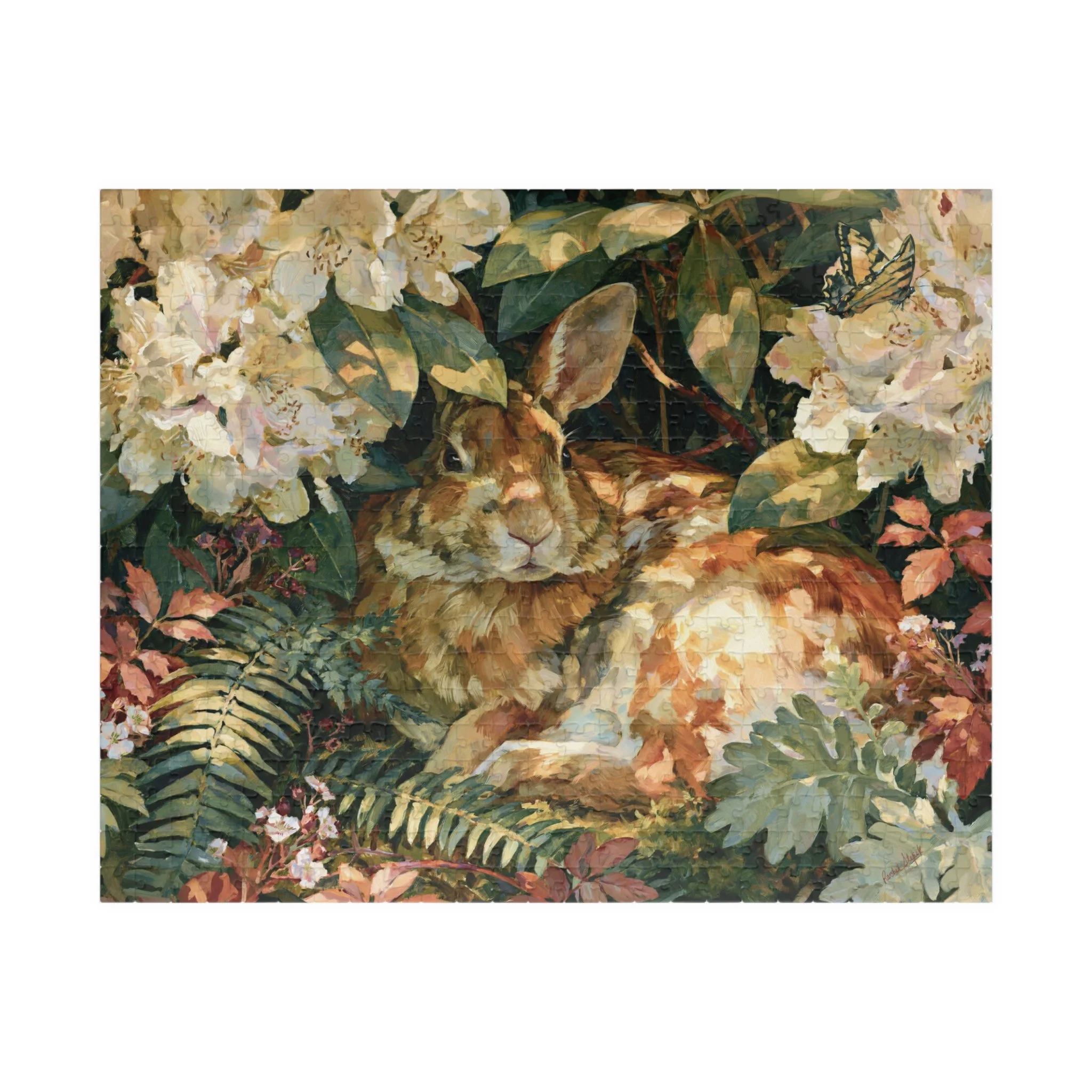 Rabbit in the Rhododendron puzzle front artwork featuring an Eastern cottontail resting among rhododendron blooms, ferns, moss, and soft woodland leaves