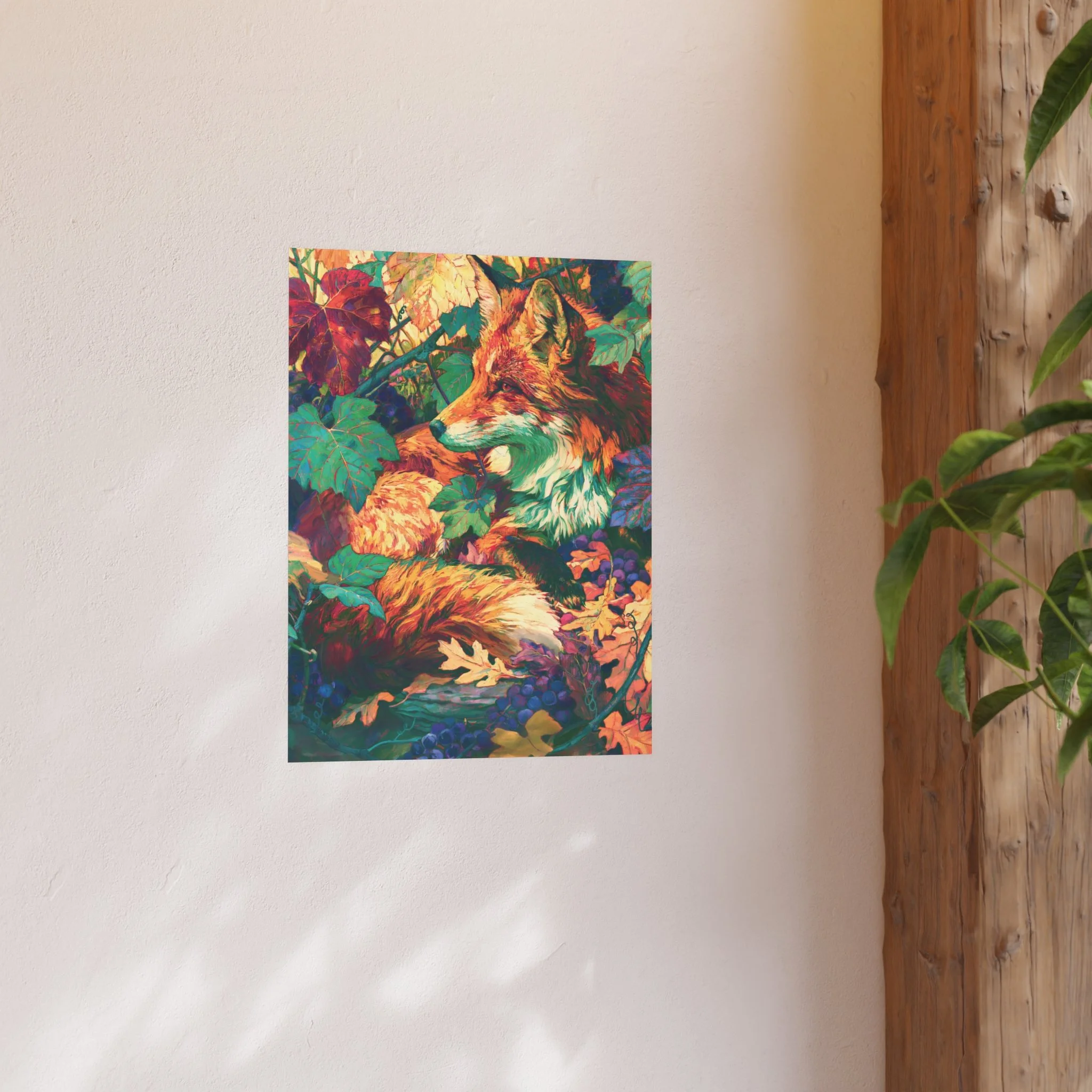 Red Fox in the Muscadine Vines 18 x 24 art print displayed on a light wall beside a wood shelf and green plant