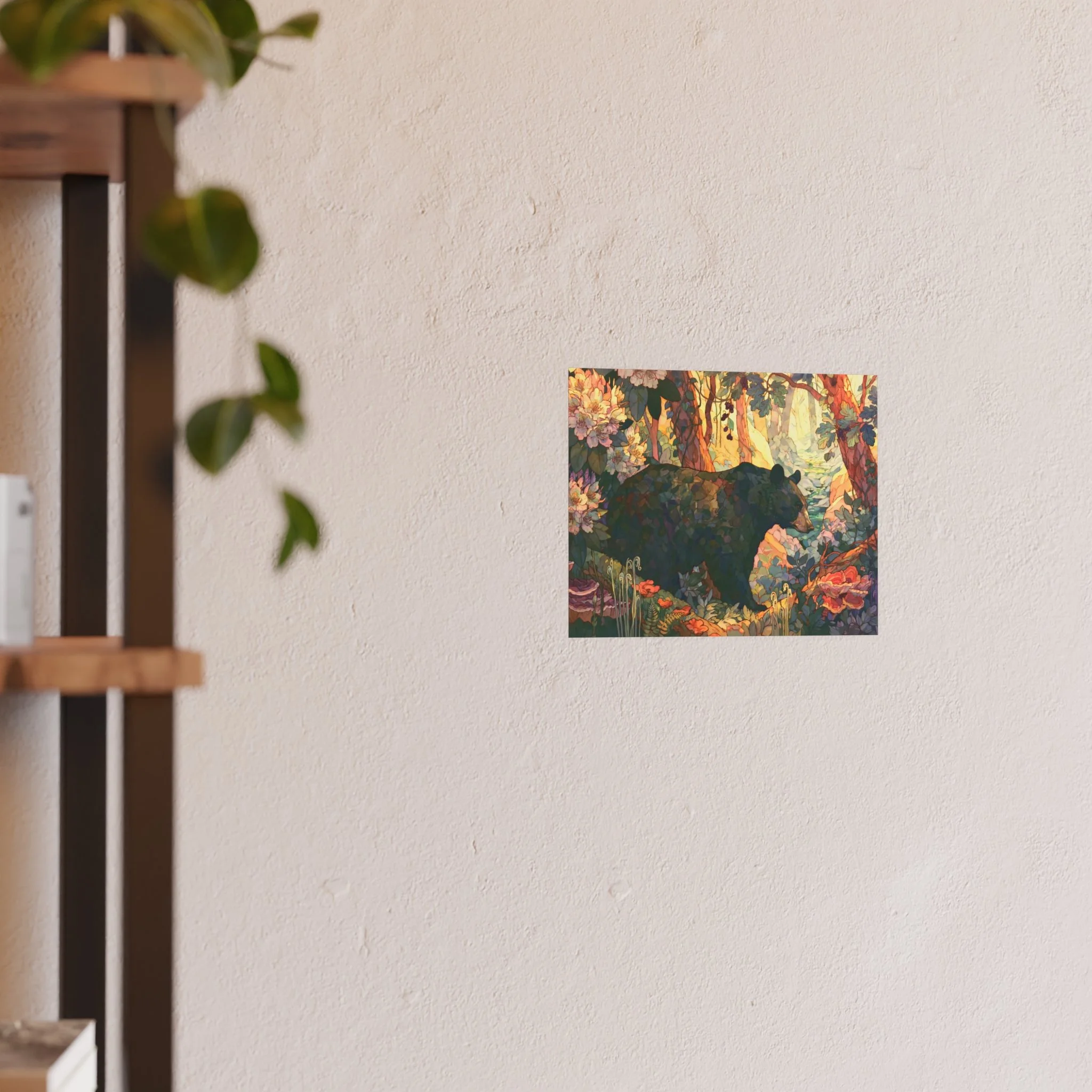 Black Bear Forest 10 x 8 art print displayed on a light wall beside a wood shelf and green plant