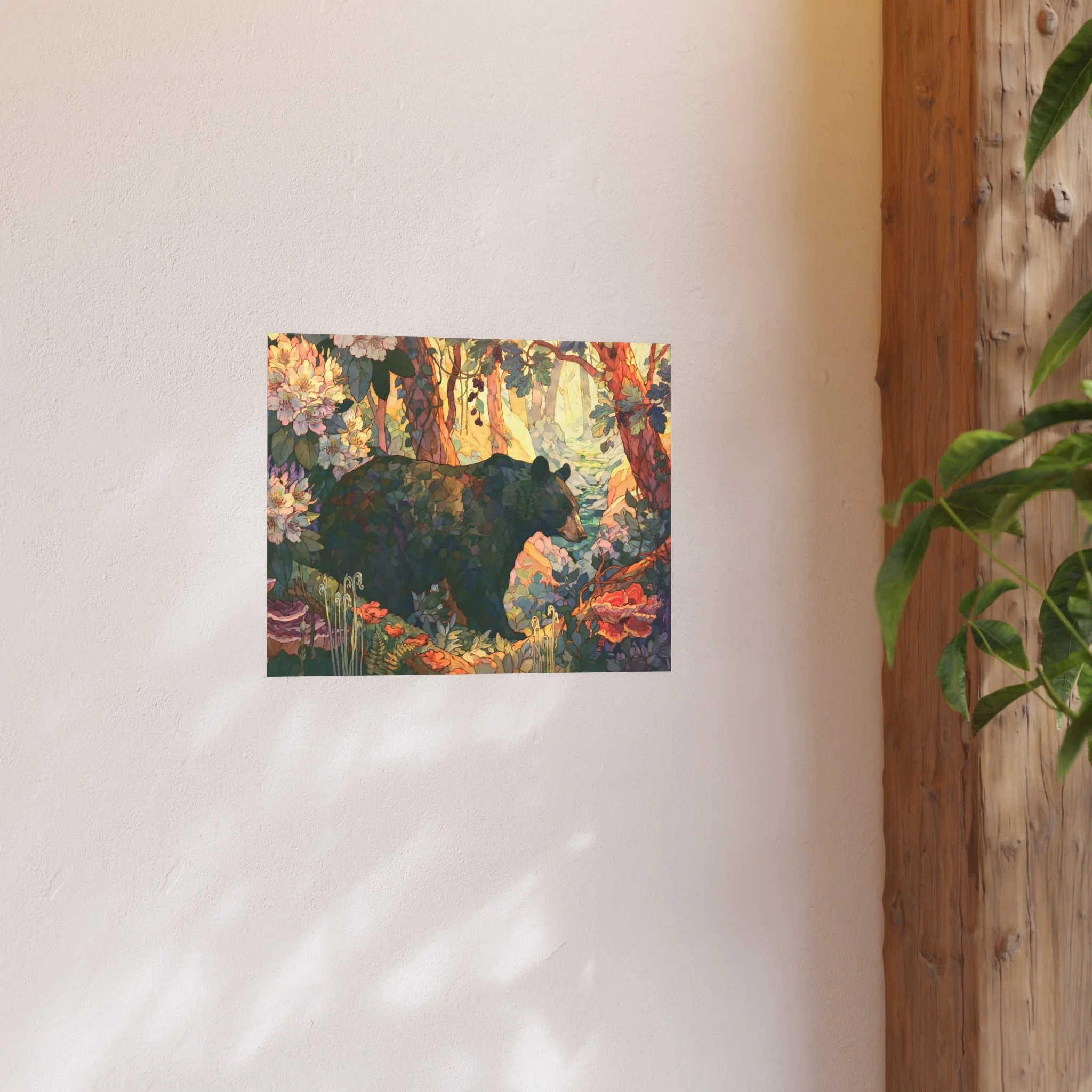 Black Bear Forest 20 x 16 art print displayed on a light wall beside a wood shelf and green plant