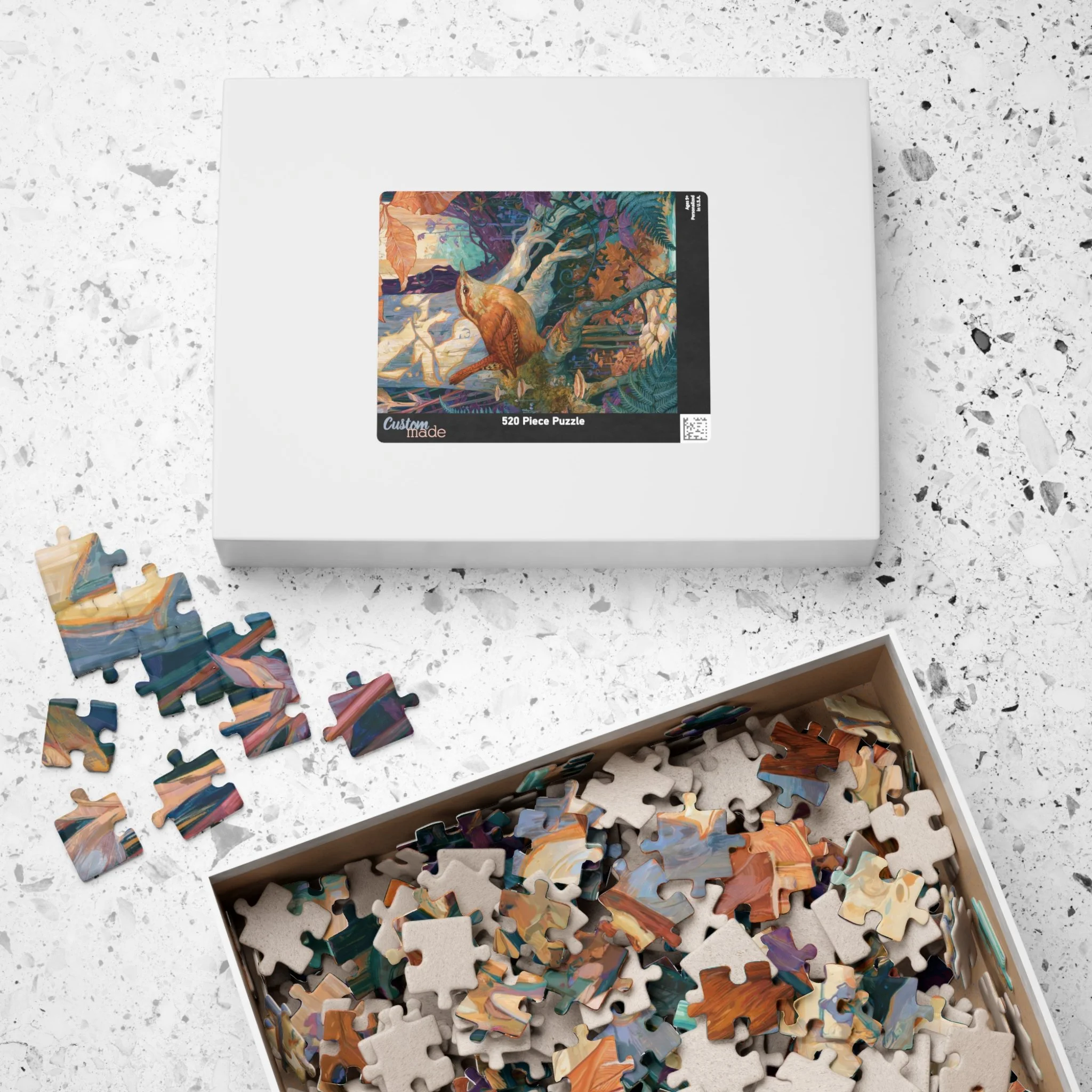Carolina Wren in the Beech Roots puzzle with its paper box featuring the complete artwork by Rachel Stepek.