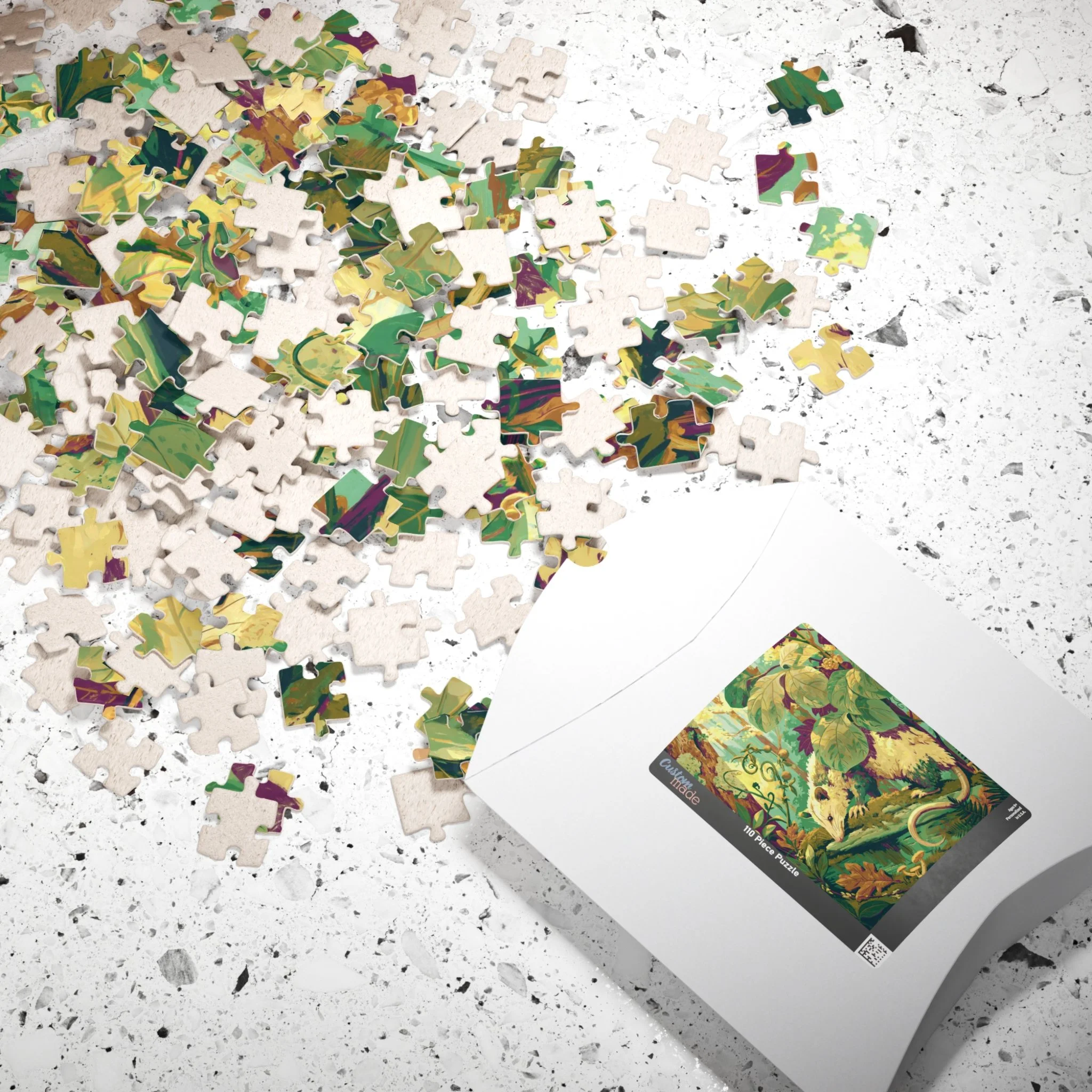 Opossum on the Mossy Log jigsaw puzzle with its paper box and reference print featuring the complete Virginia opossum artwork by Rachel Stepek.