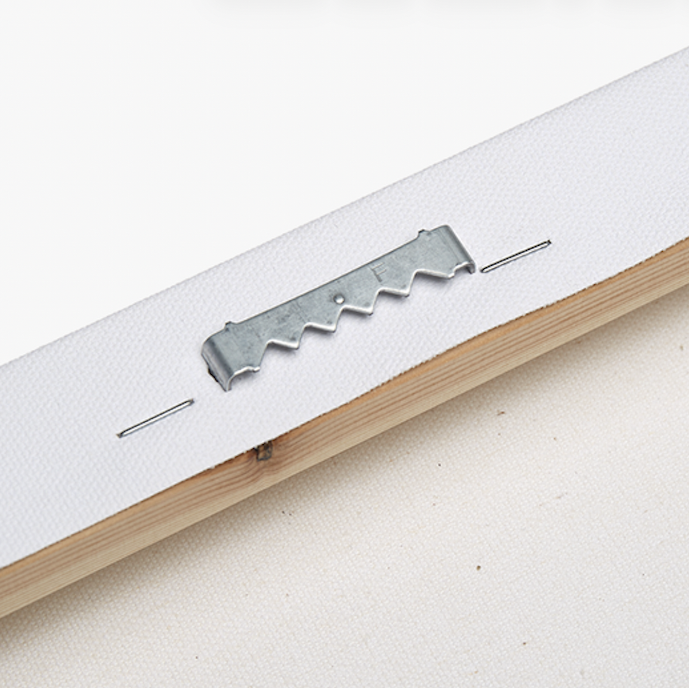 Close detail of installed canvas hanging hardware