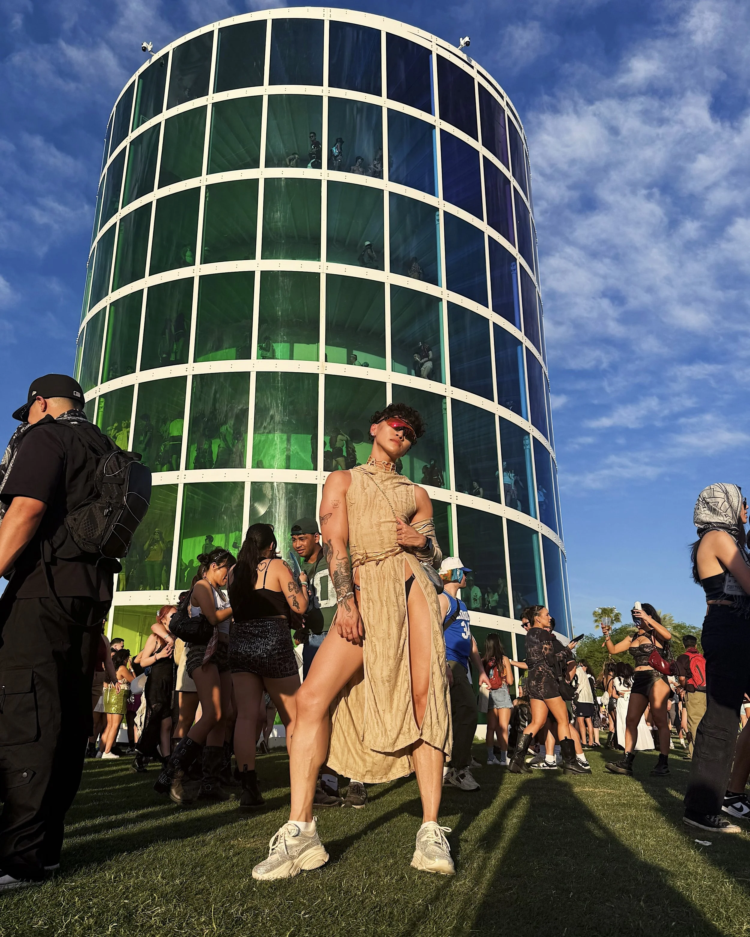 AJ Harley at Coachella 2025 wearing a Dune-inspired sand coloured festival look with gold jewellery.