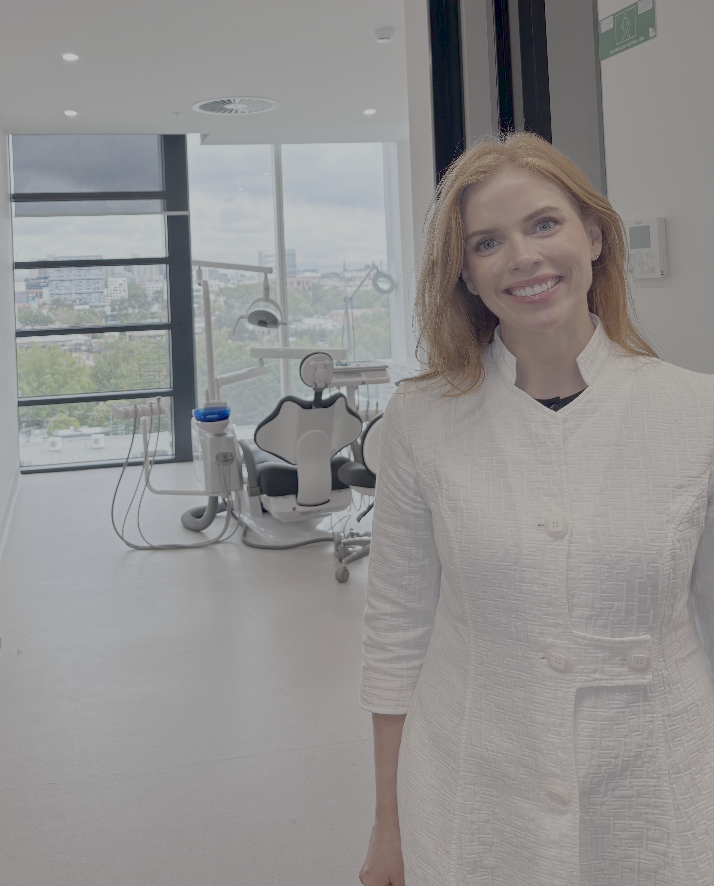Dr Aimee Dunne standing in The Bonding Studio treatment room