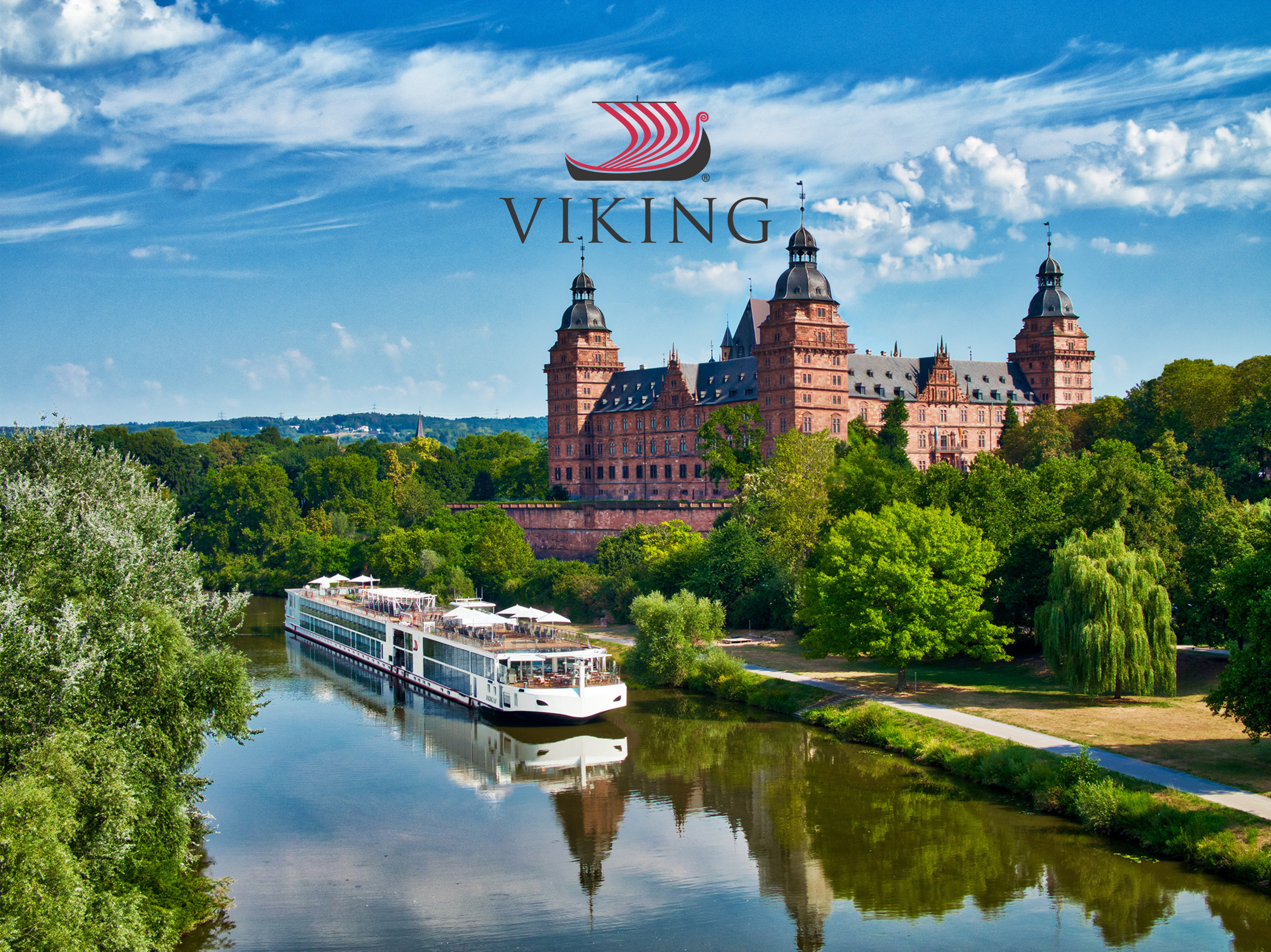 Castle on a hill with a river and boat in the foreground, under a blue sky with some clouds, and a Viking logo with text overlay.