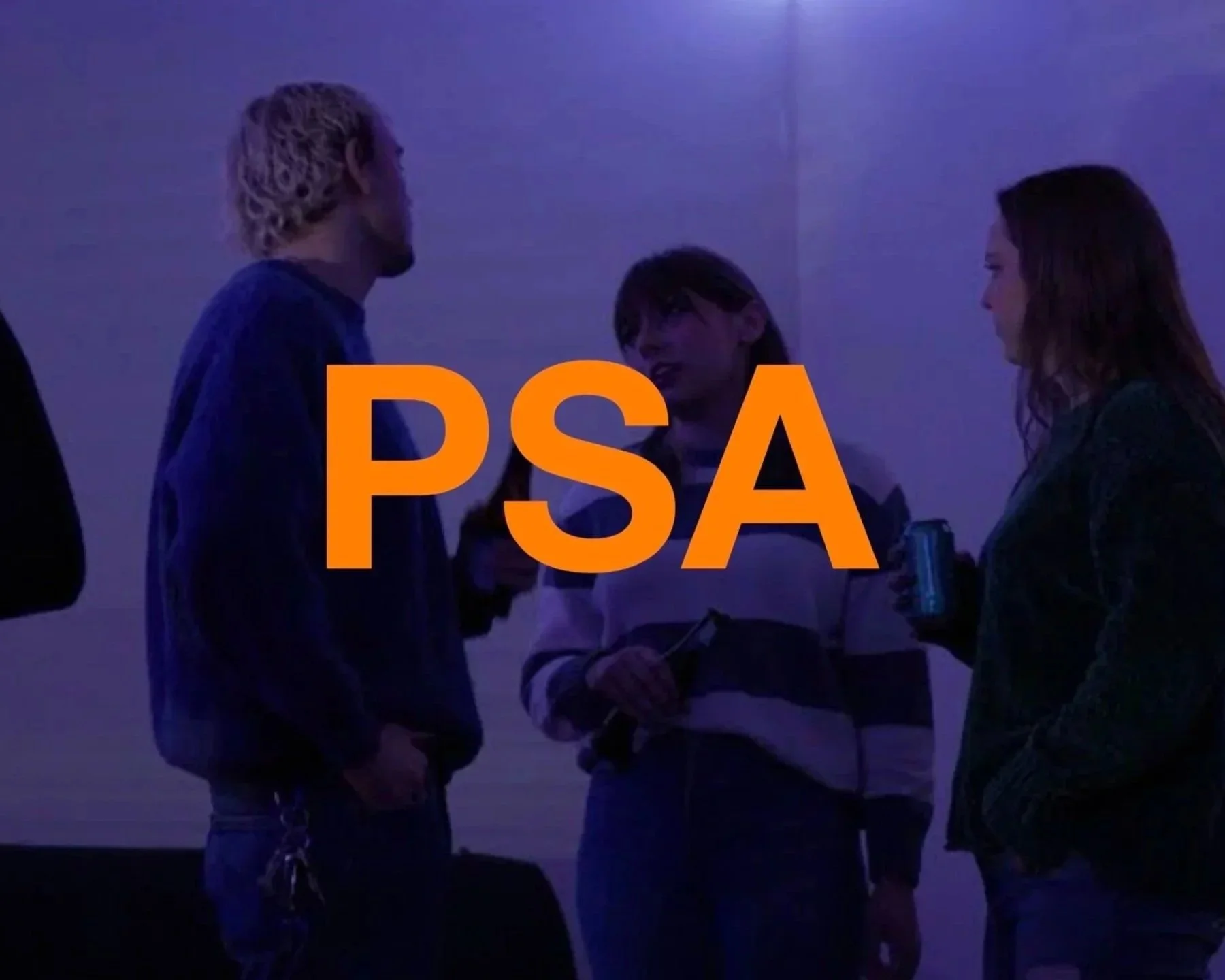 Group of four young adults engaged in conversation at a social event with blue and purple lighting. Large orange text overlay reading 'PSA'.
