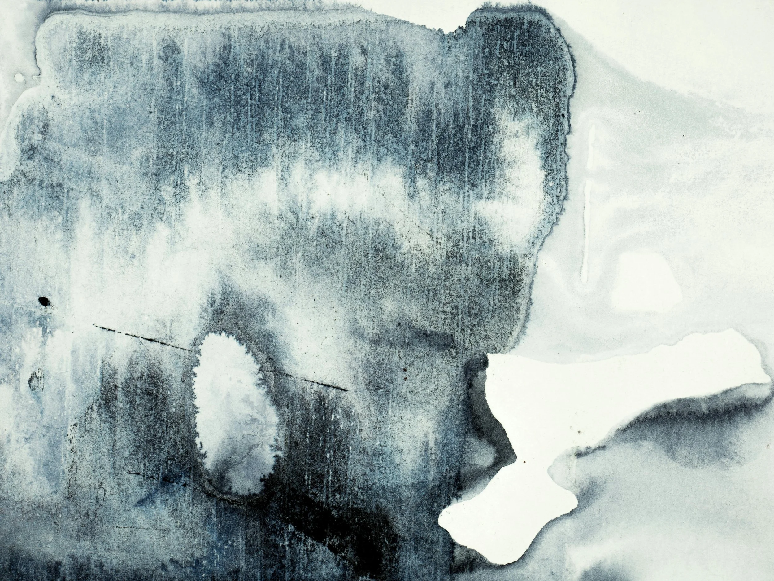 Abstract watercolor painting in shades of black, gray, and white, with organic shapes and textures.