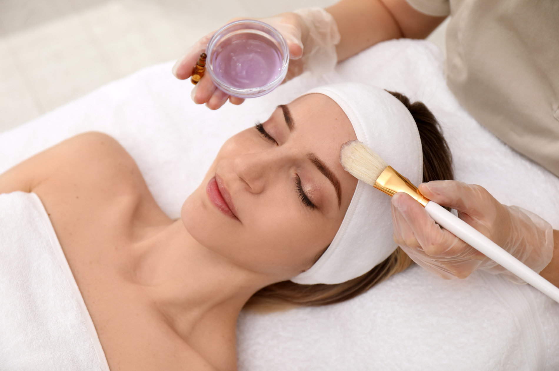 Client receiving a professional peel skin treatment.