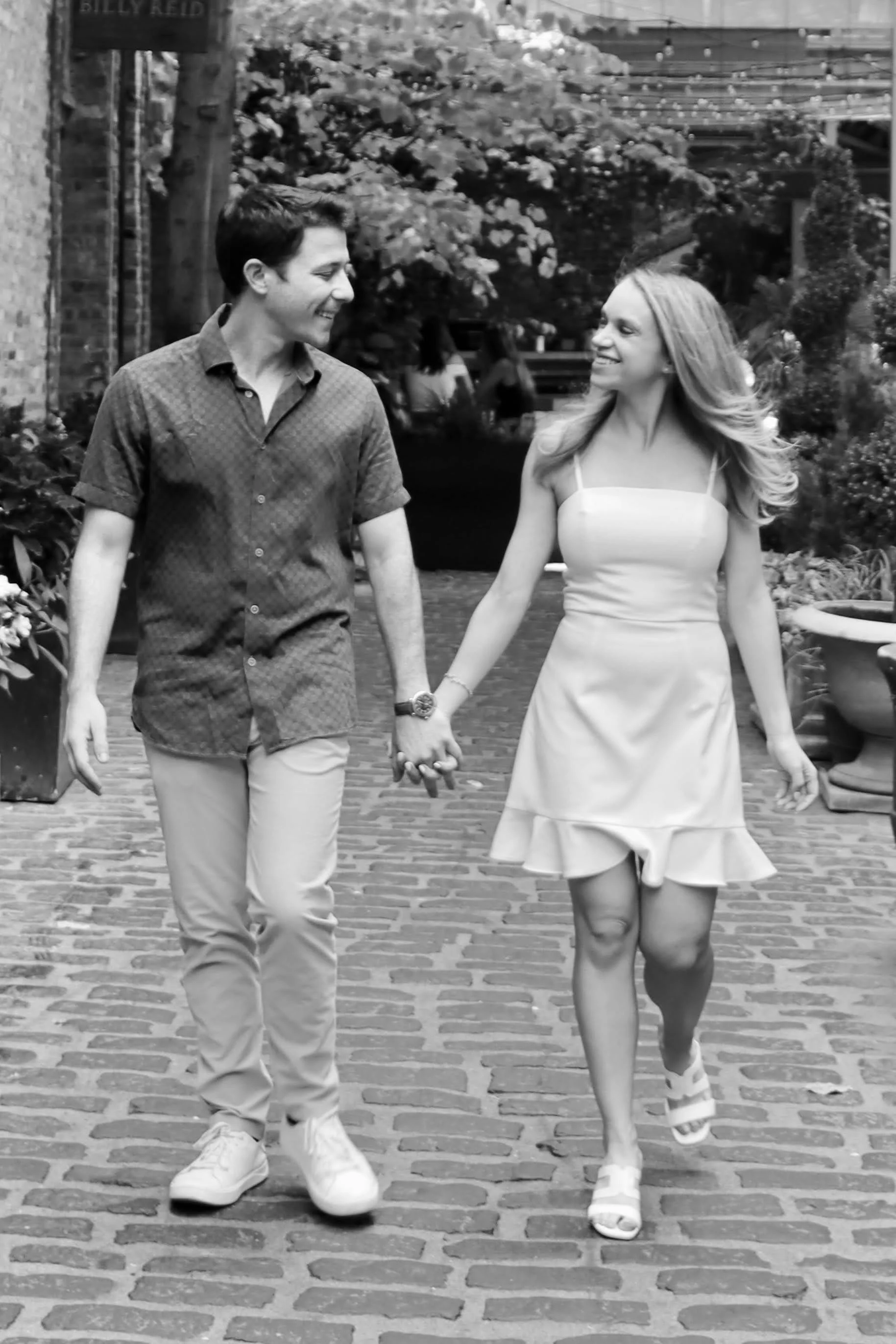 Jojo Rubnitz Photography Engagement black and white holding hands brick road.JPG