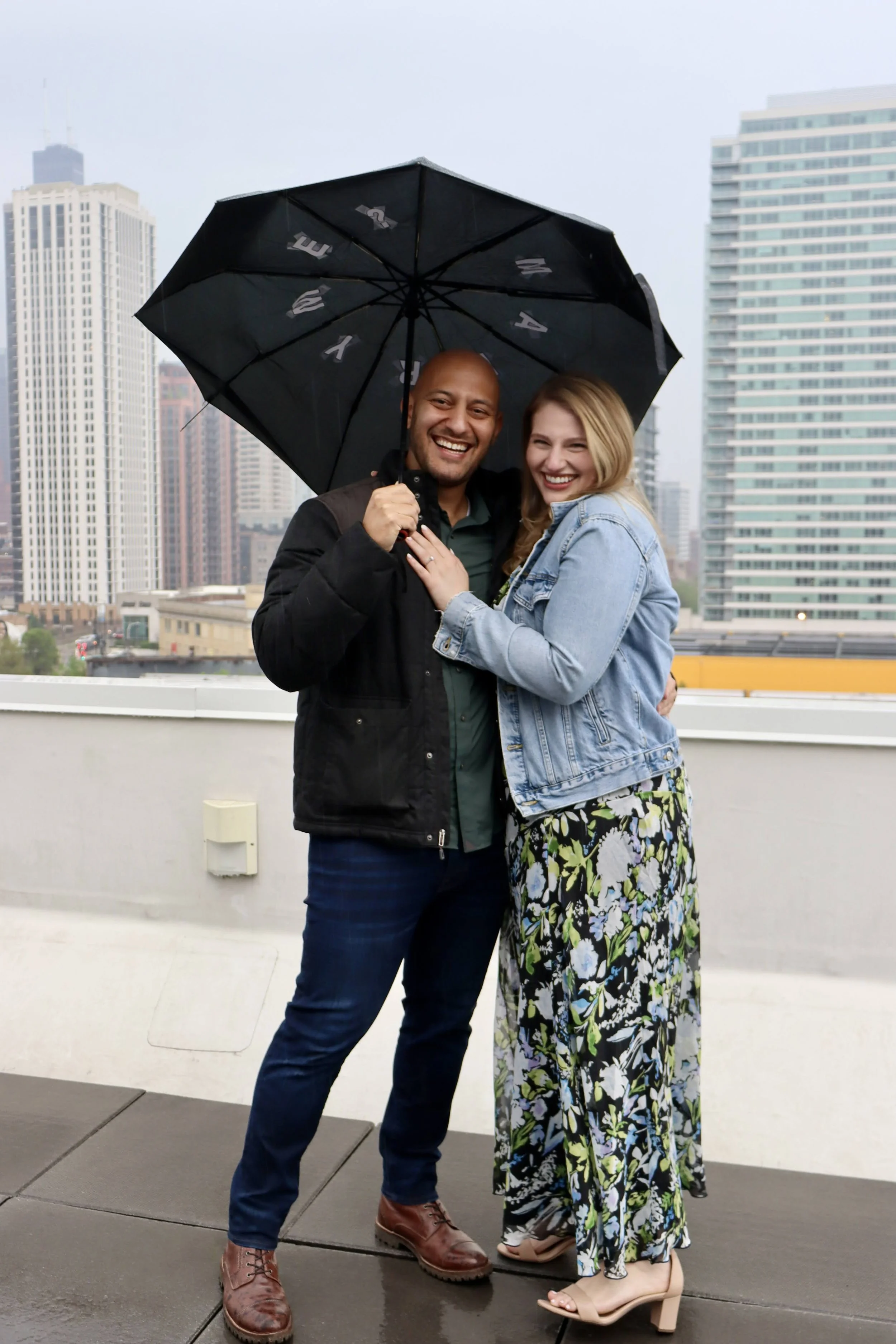 Jojo Rubnitz Photography Engagement city raining umbrellas smiles in the tain proposal.JPG