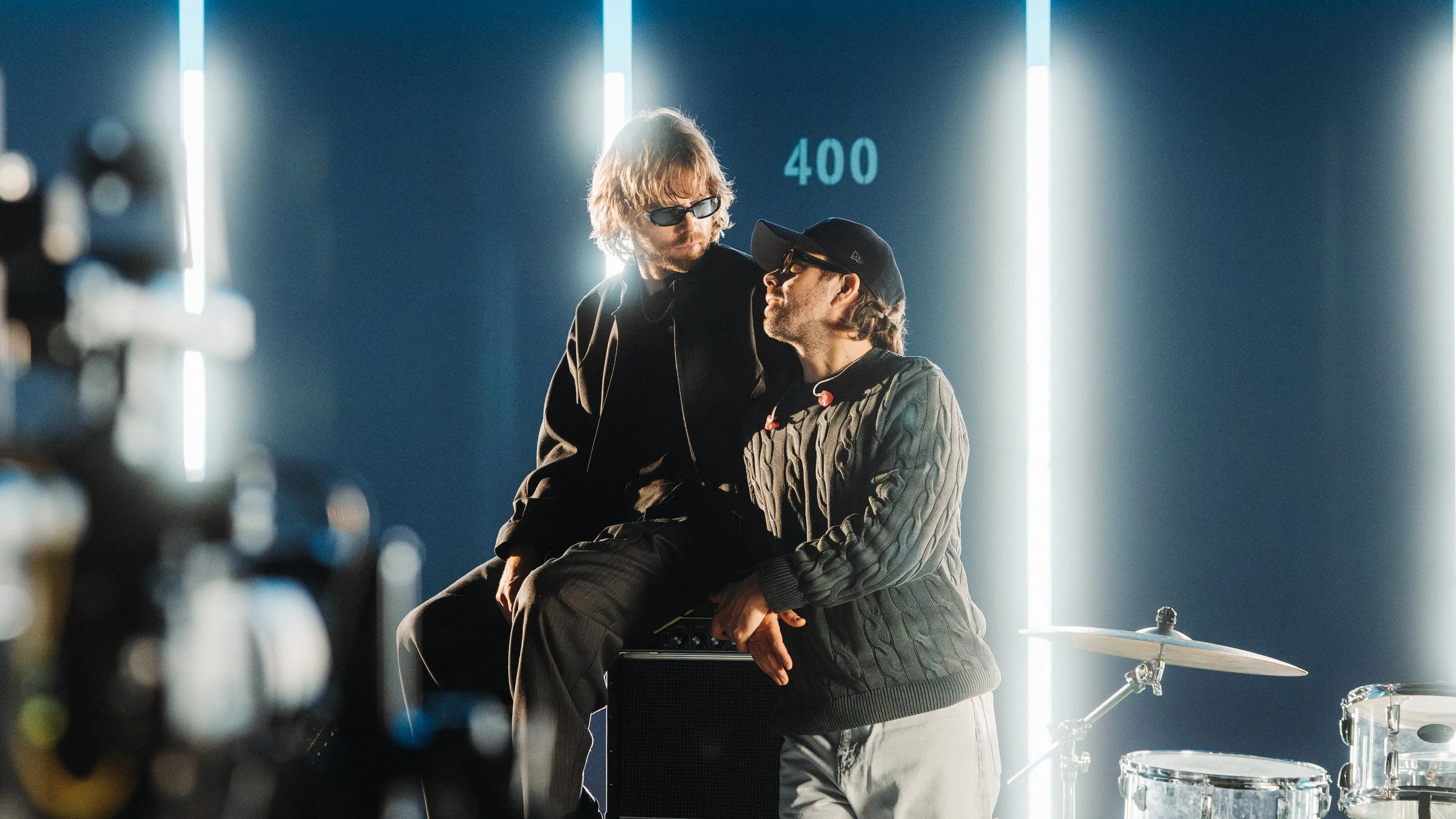 Jason Couse and Wes Marskell of The Darcys posing for a photo looking at each other.