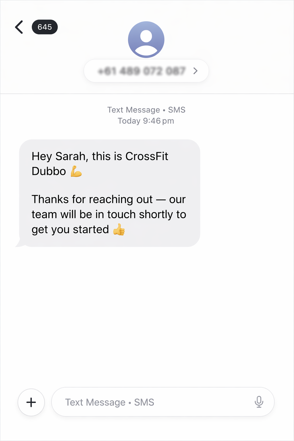 Screenshot of a text message from CrossFit Dubbo, introducing themselves with a flexed biceps emoji and thanking the recipient for reaching out, with a thumbs-up emoji at the end.