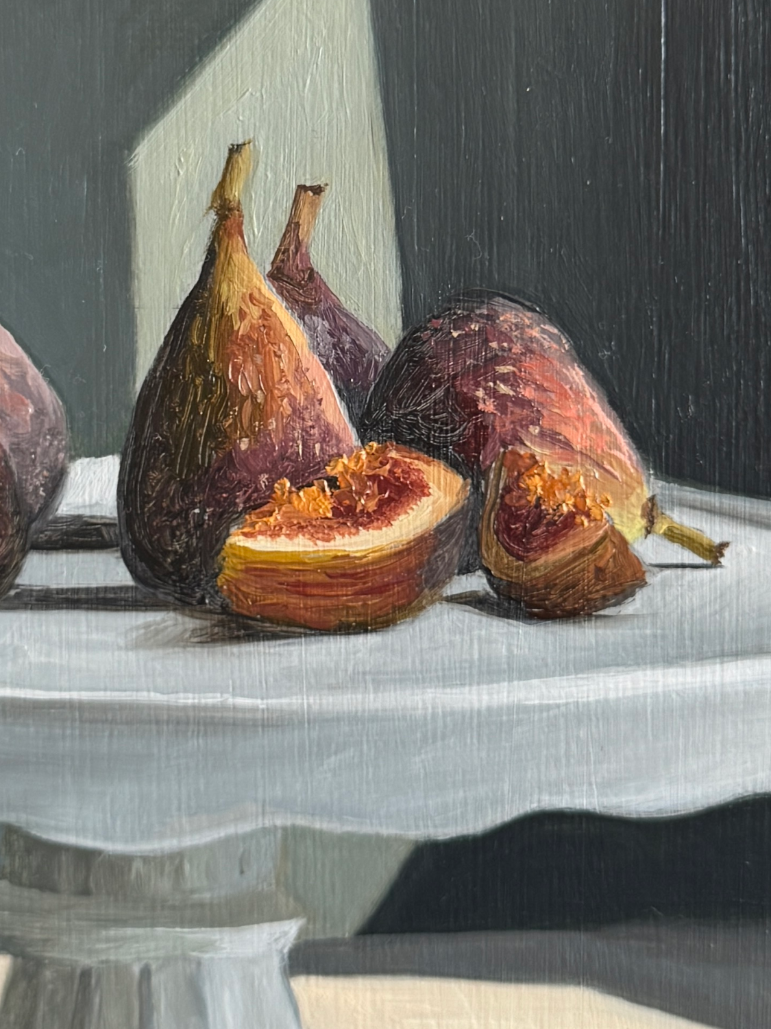 Close up of still life oil painting of figs showing brushwork and texture