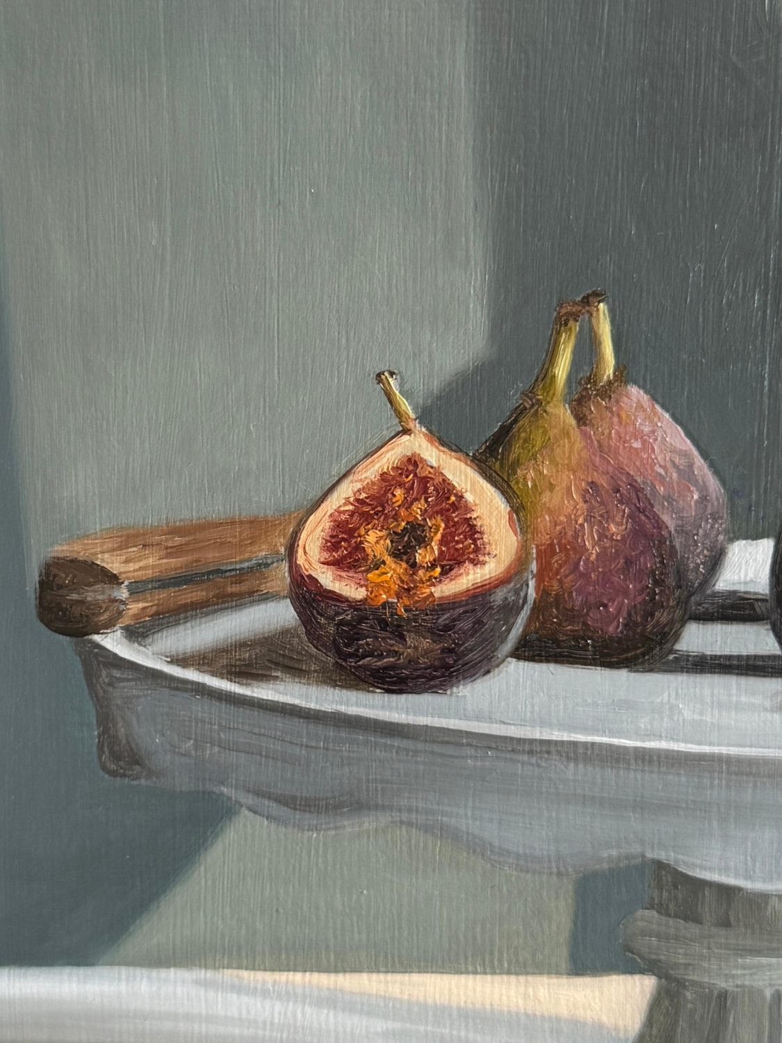 Close up of still life oil painting of figs showing brushwork and texture