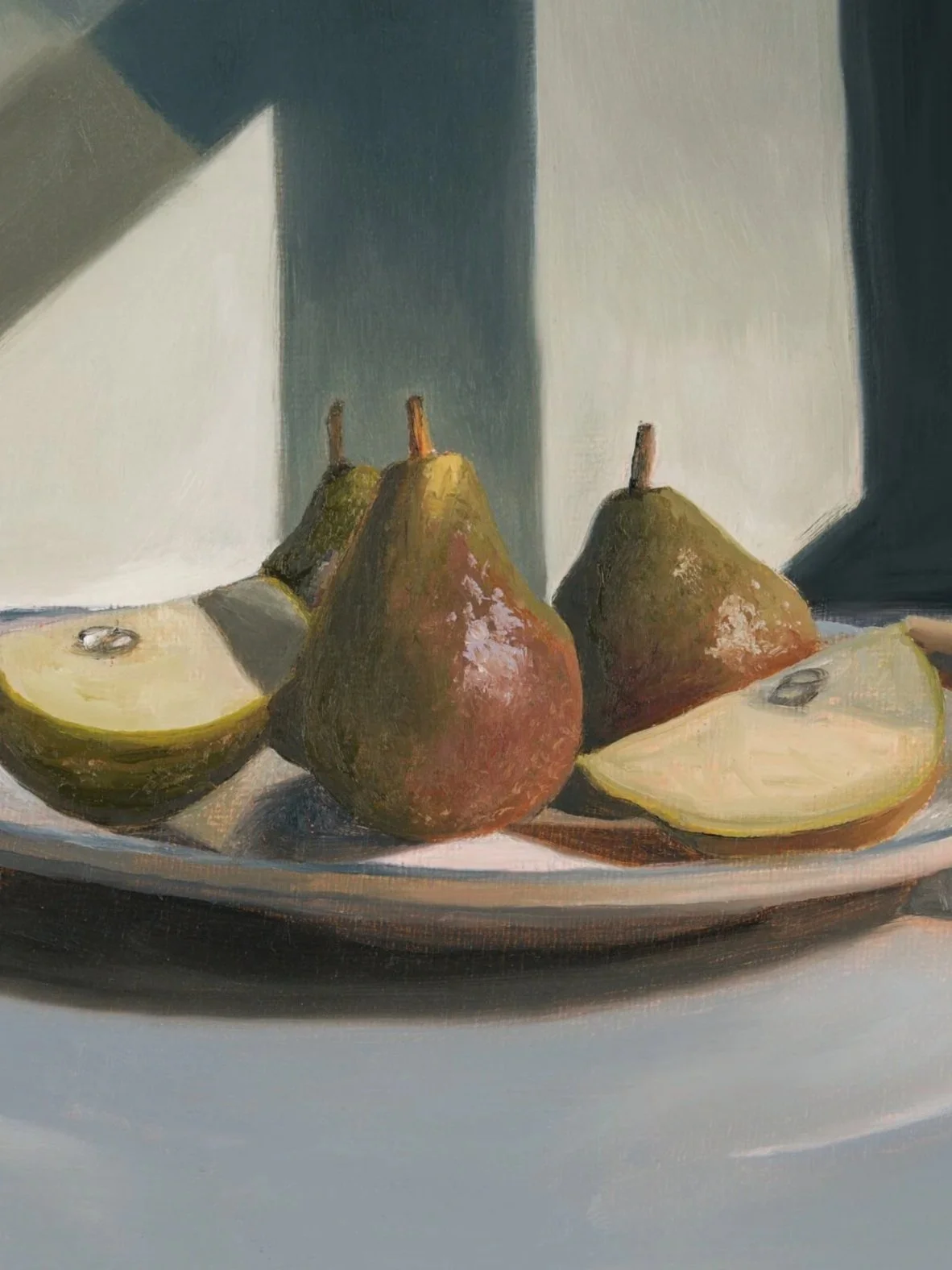Close up of fine art reproduction showing brushwork and texture of pears on a plate