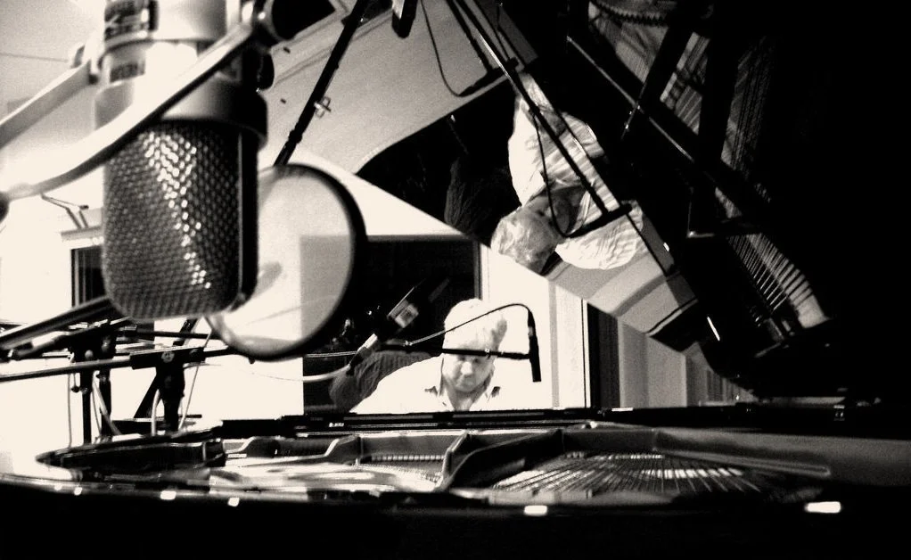 Darin Niebuhr playing piano at the recording studio
