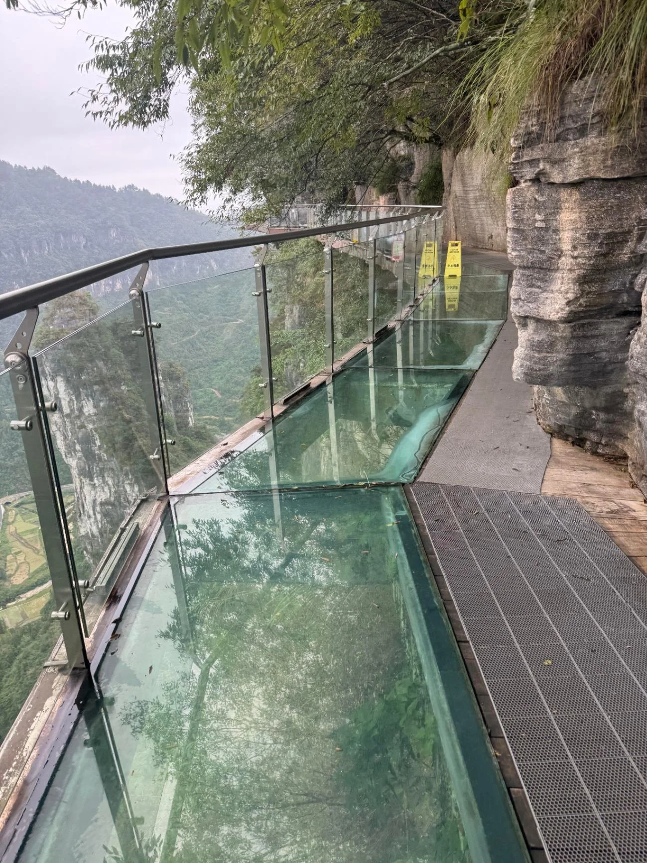 Glass plank walkway on the Aizhai cliff path above the Dehang Canyon,   Xiangxi, Hunan