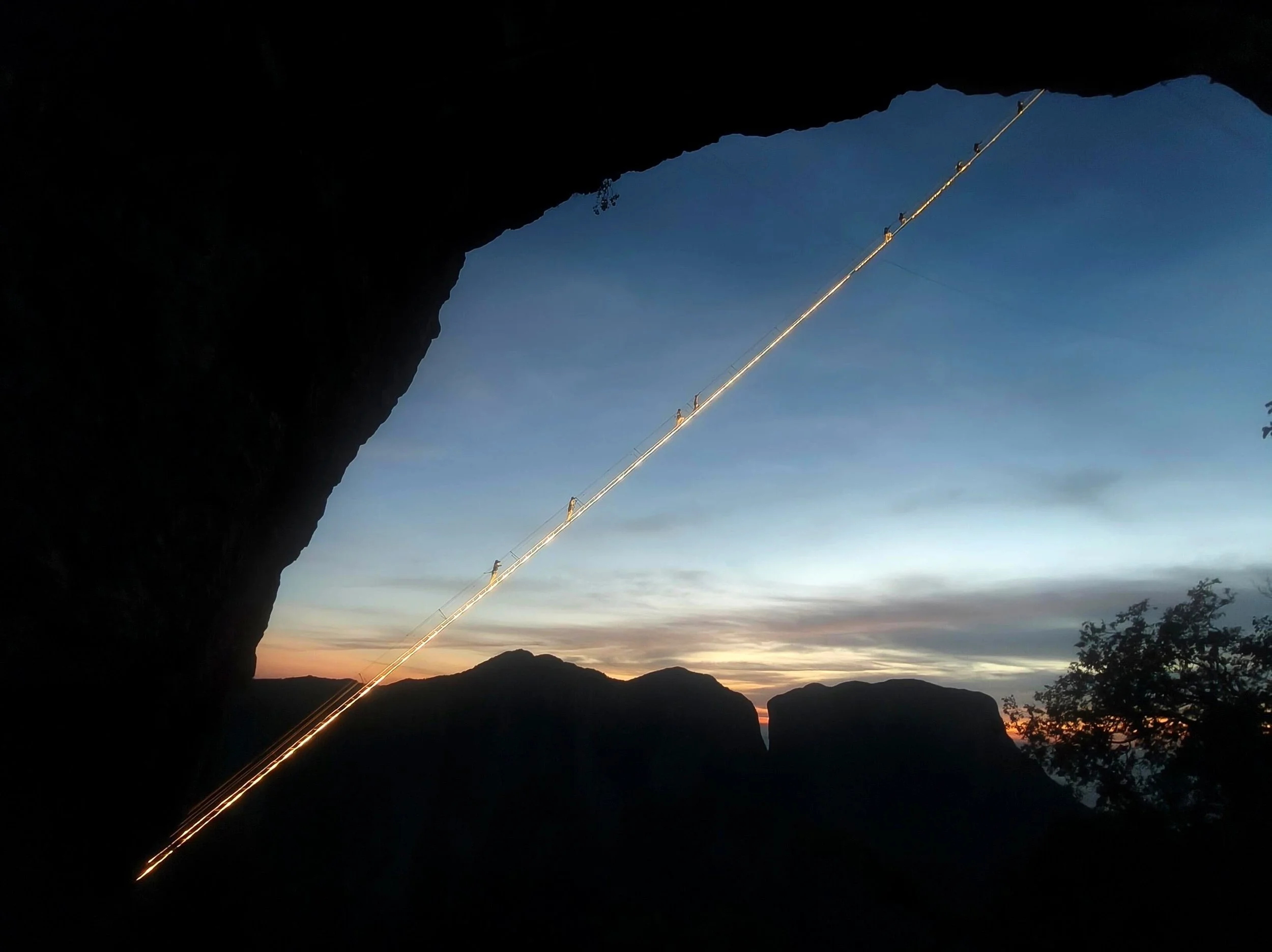 The via ferrata on Qixing Mountain, Zhangjiajie, lit against the night sky