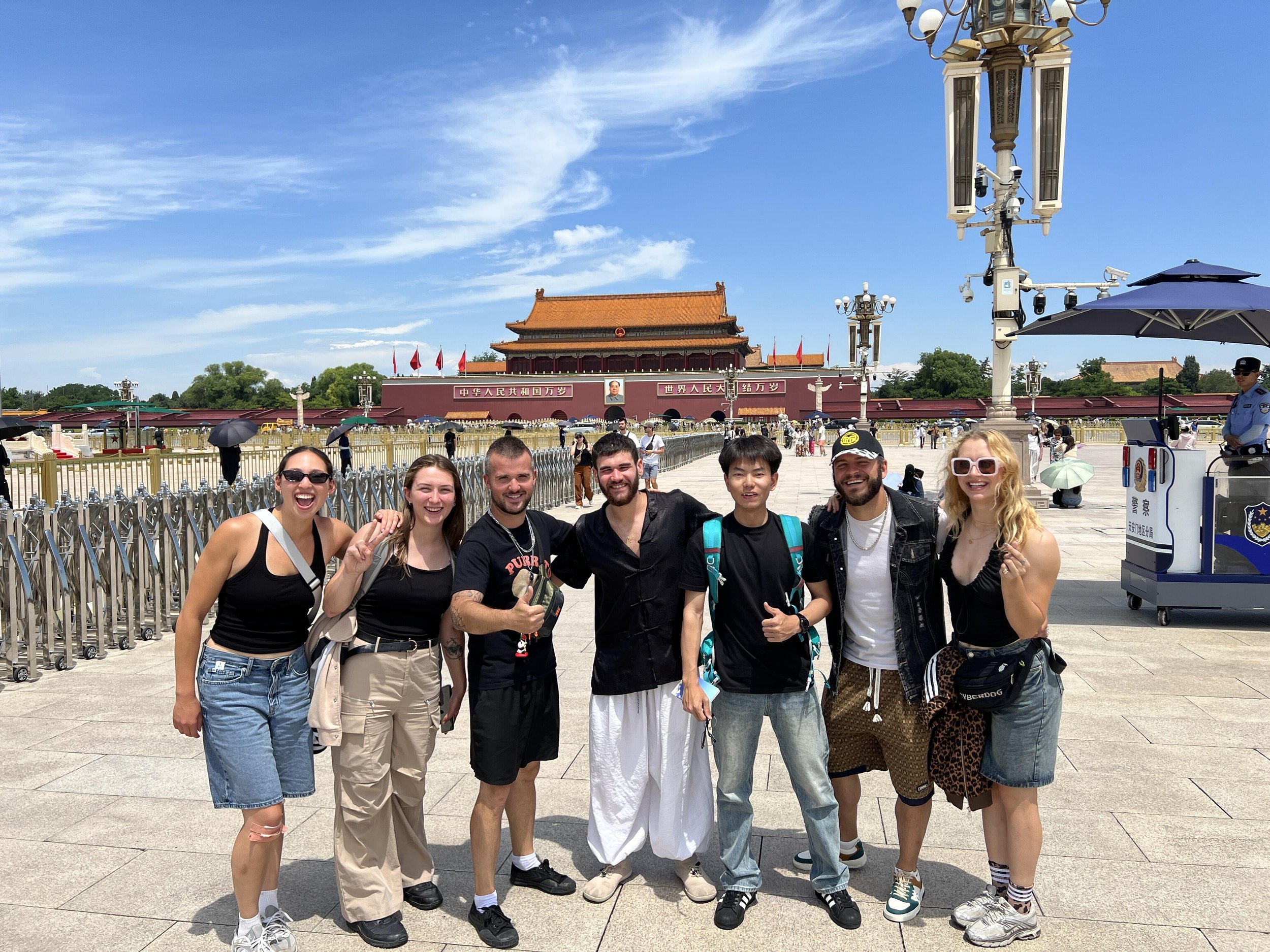 Group of German car designers posing in front of the Forbidden City and Tiananmen Square during a private Beijing tour