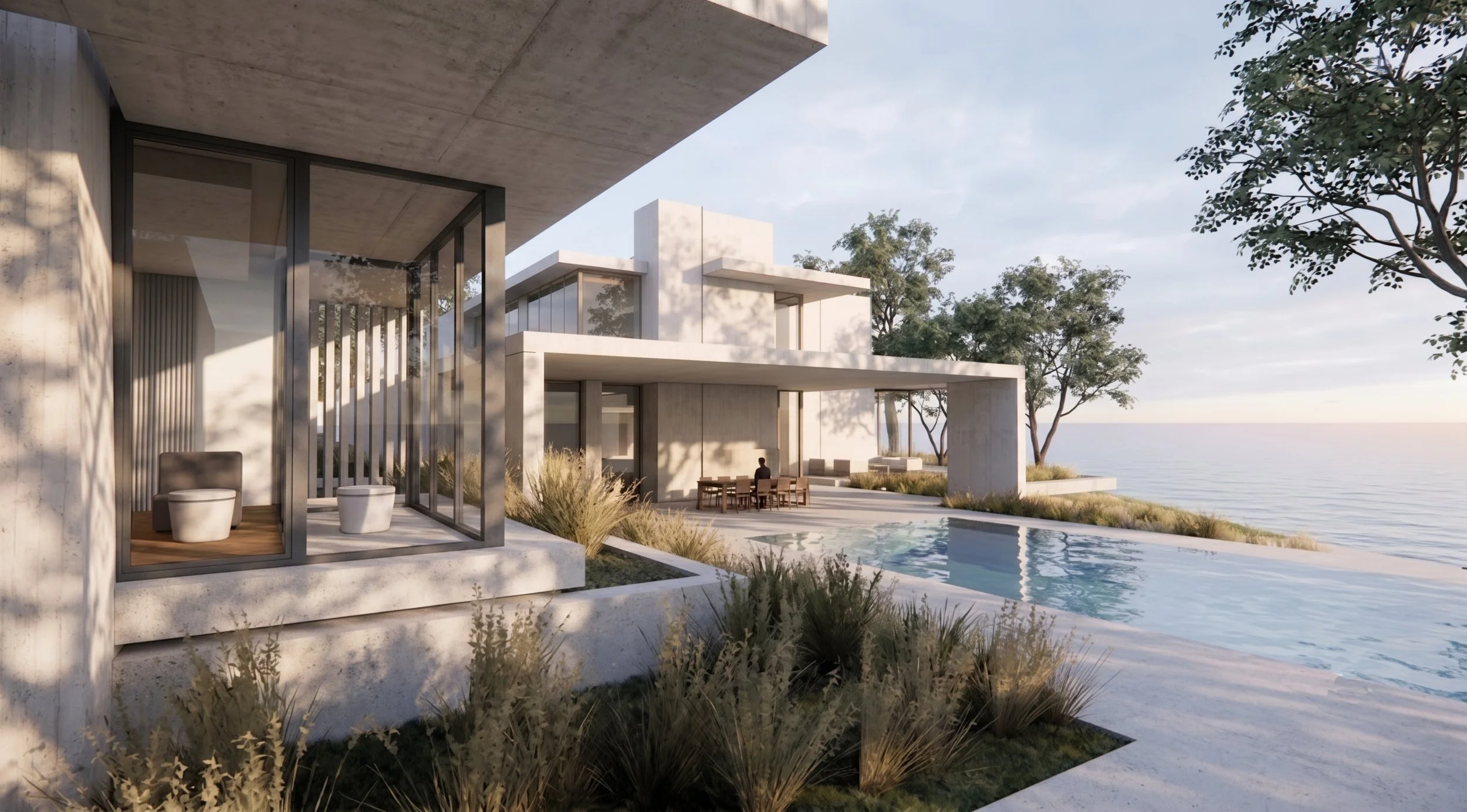 Modern beachfront house with large glass windows, outdoor seating area, swimming pool, and ocean view, surrounded by trees and landscaped yard.
