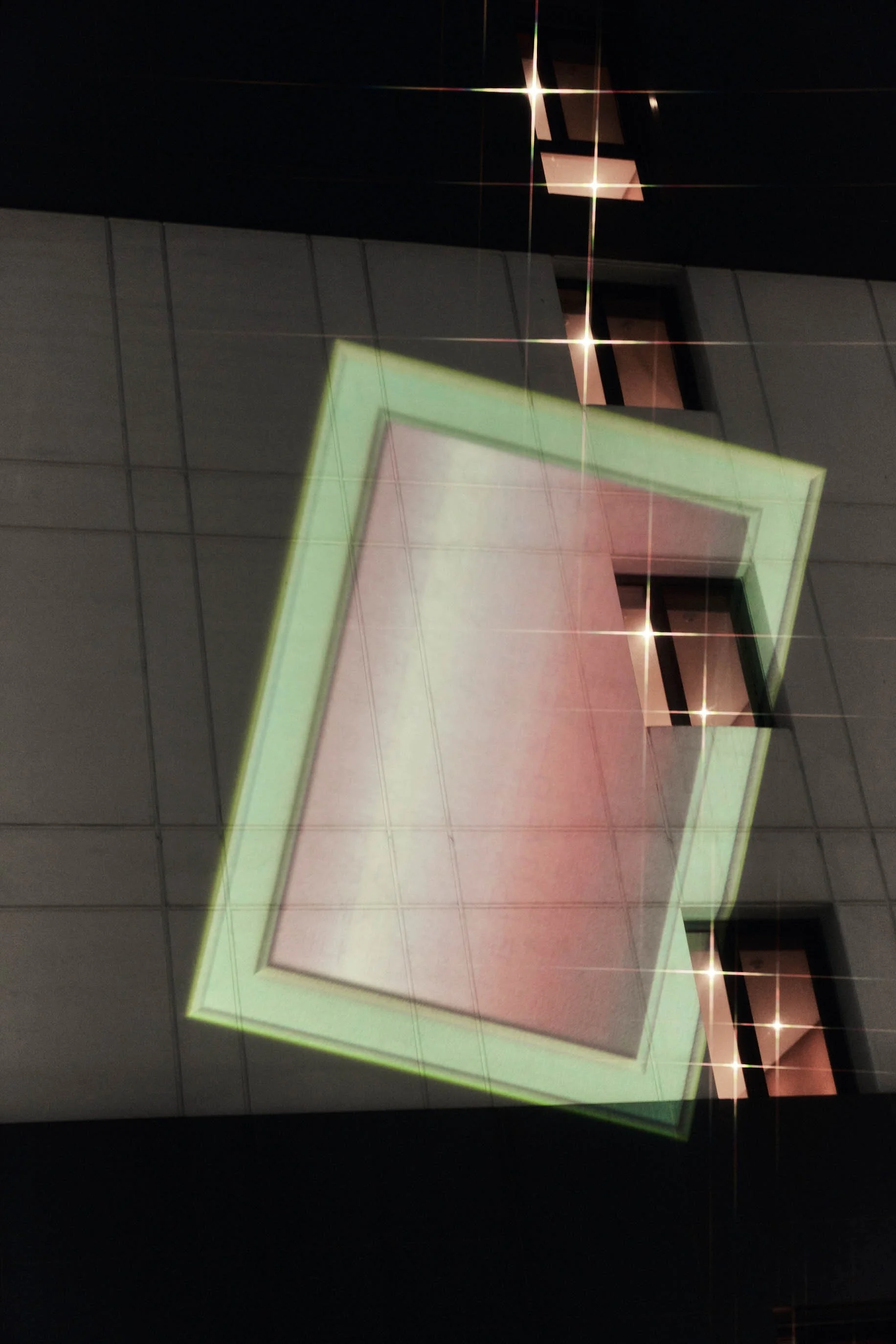 fldjf_greyframe_명동역중국여자안경테의일부sample, 2015, projection on a outer wall of a building, guerilla gesture, 2021
