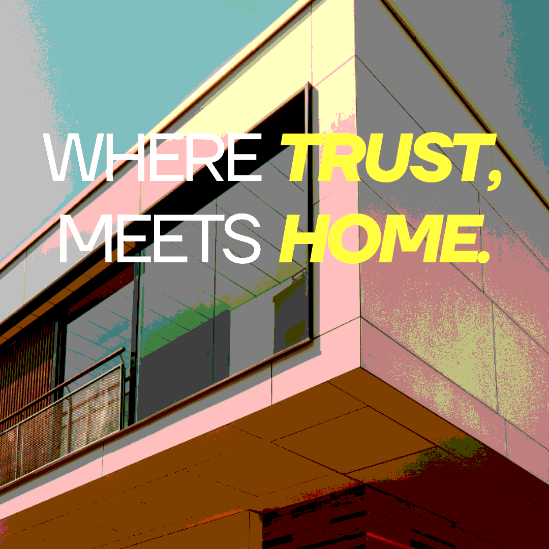 A modern building facade with large windows and an overhanging roof, with the text 'WHERE TRUST, MEETS HOME' overlaid in large, colorful font.
