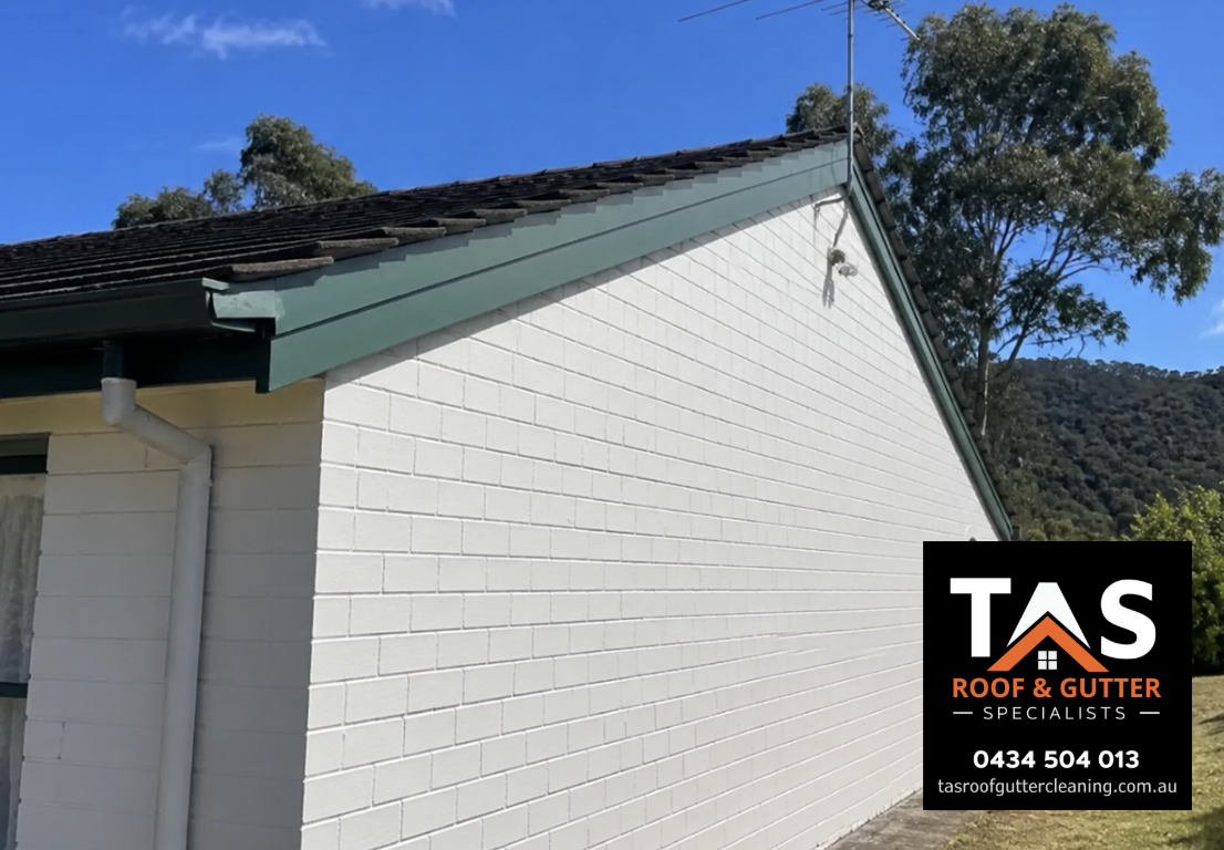 Gable end of a Hobart brick home showing tiled roofing, painted bargeboards and roof-edge details.
