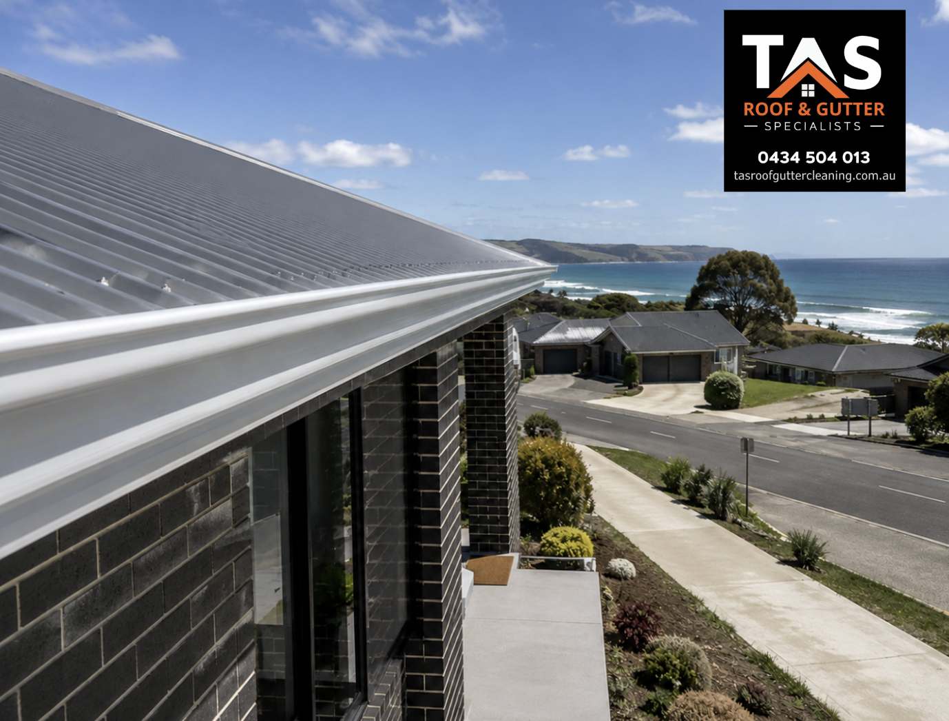 Commercial gutter cleaning in Burnie above a business car park with technician clearing blocked roof gutters