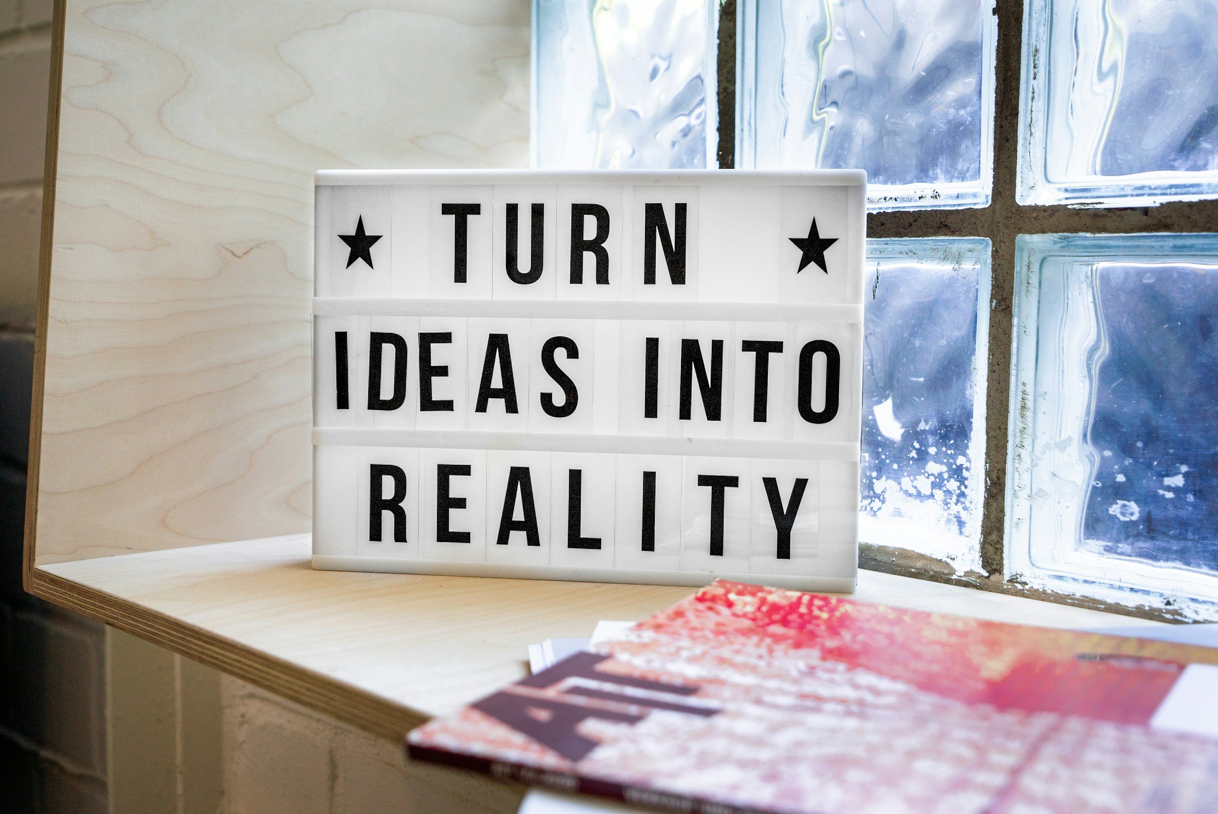 sign that says "turn your ideas into reality"