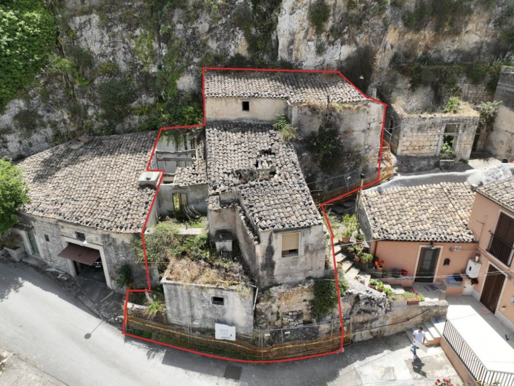 A Hidden Cluster of Stone Houses