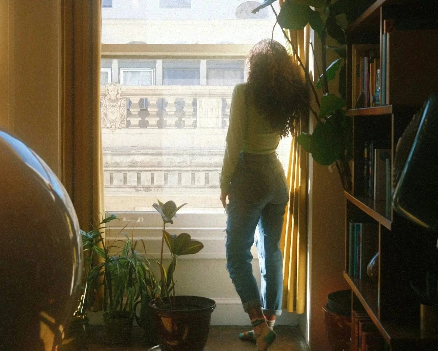 Female expat settling in new apartment in new city