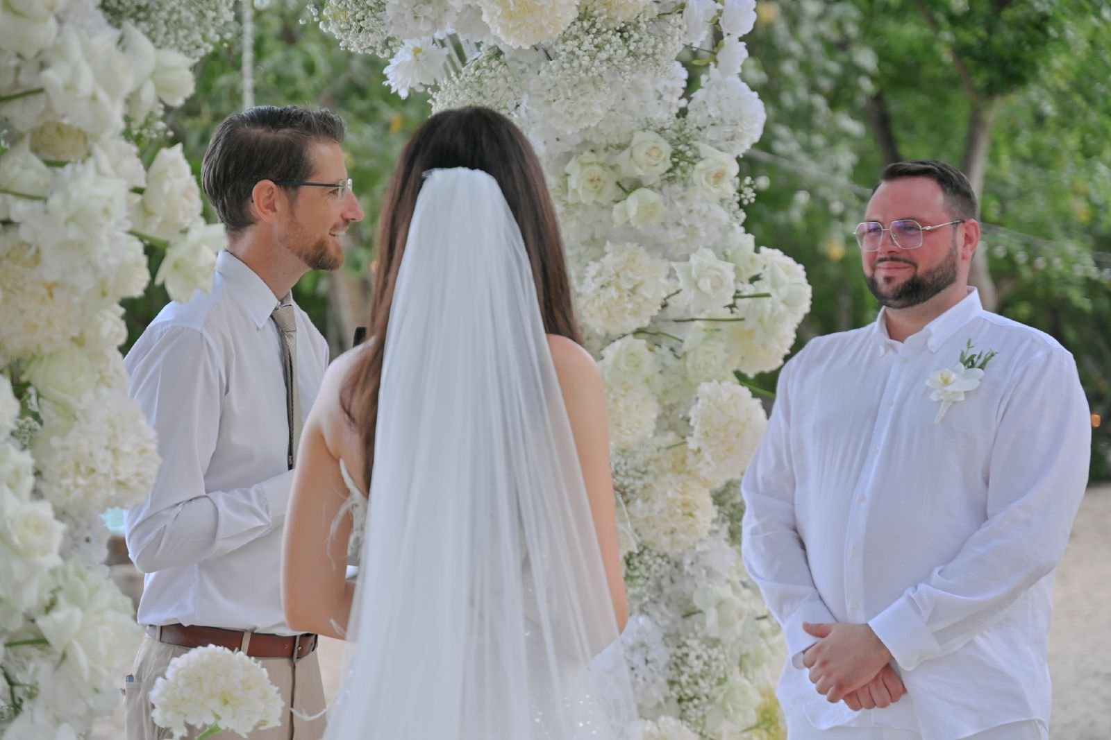 Wedding planner discussing details with bride at a beach wedding venue in Phuket with ocean view