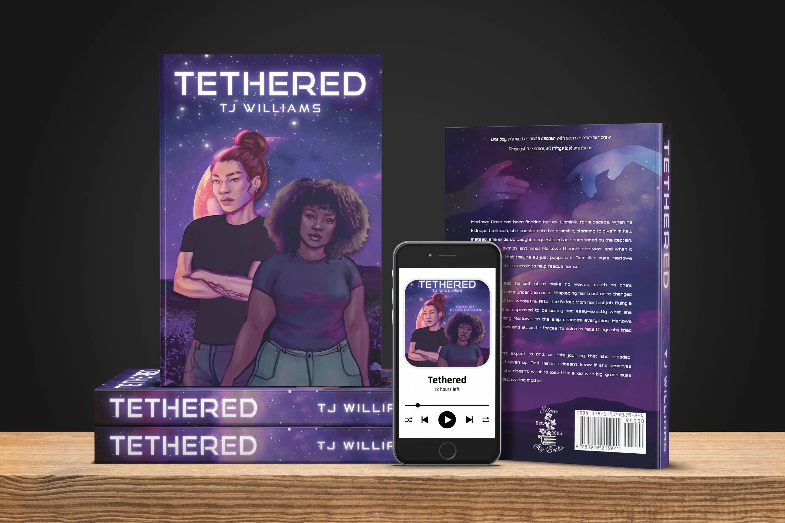 "Tethered" paperbacks by TJ Williams with an illustrated cover showing two women; one tall, muscled masc and Brown with long hair in a bun and the other short, fat fem and Black with curly dark hair. A smartphone displays the audiobook cover.