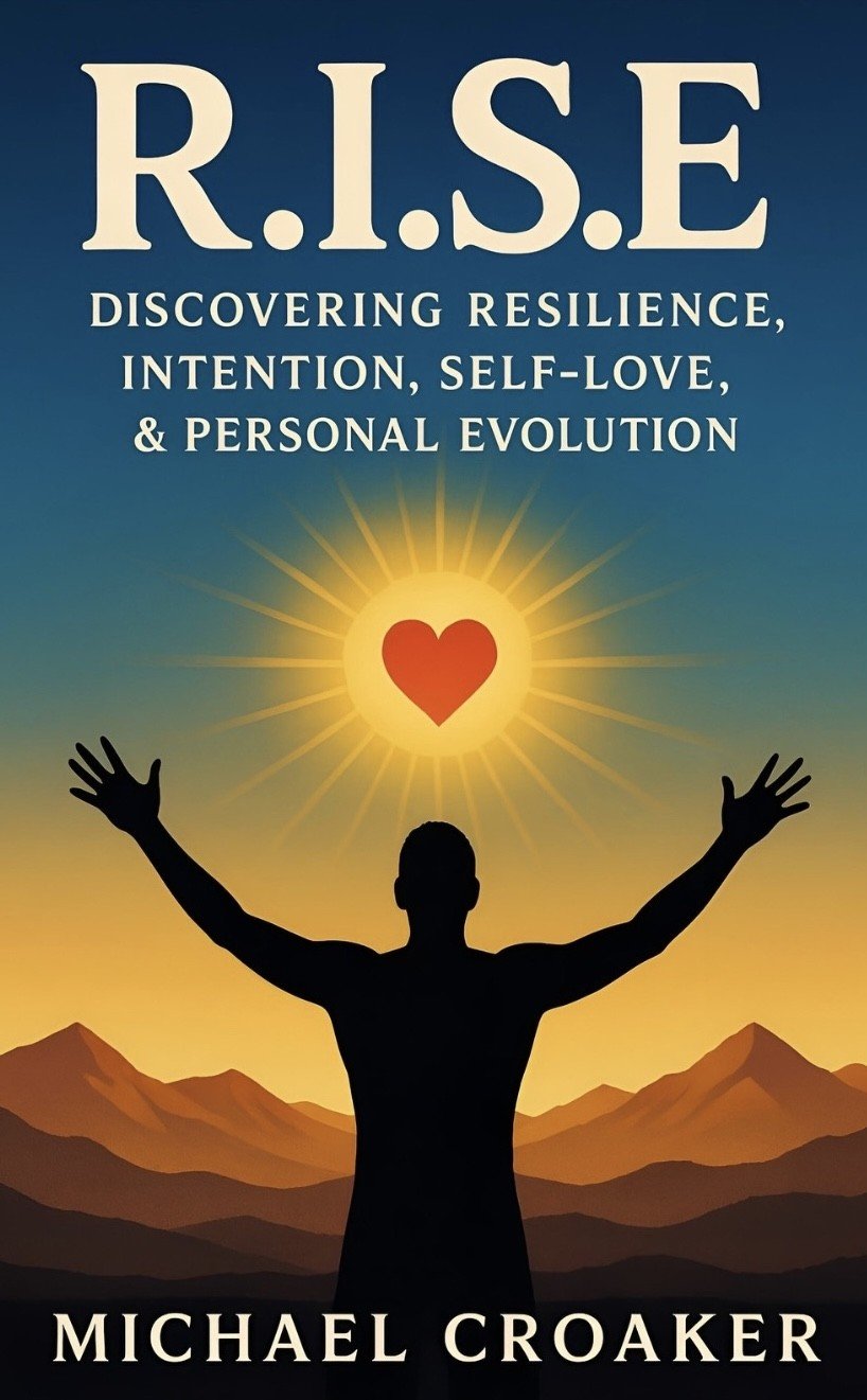 Book cover titled "R.I.S.E." by Michael Croaker, featuring a silhouette of a person with arms raised, a sun with a heart in the center, and mountain silhouettes in the background.