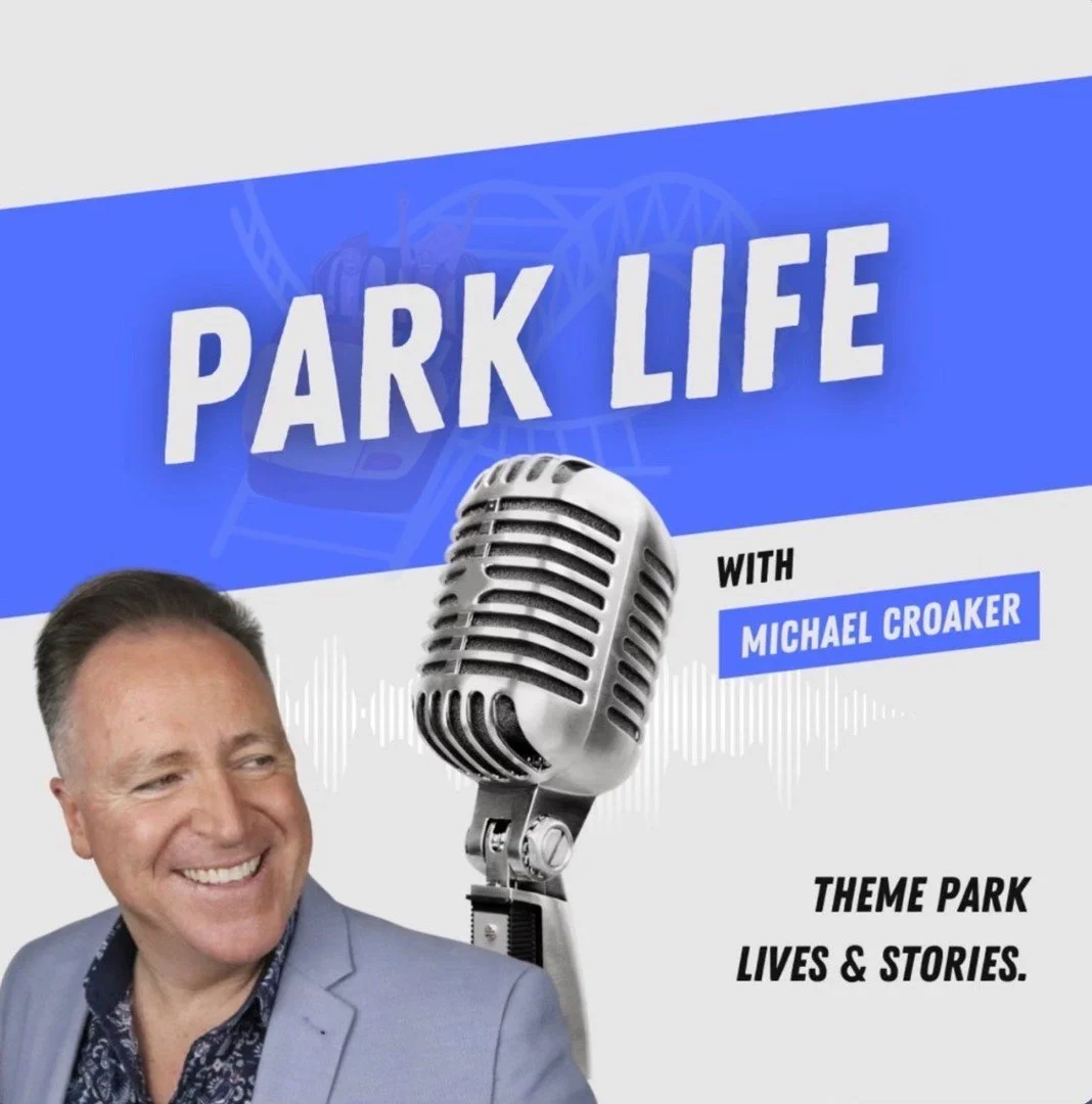 Promotional graphic for a podcast named 'Park Life' with Michael Croaker, featuring a smiling man in a suit, a large vintage microphone, and a theme park in the background. Text states 'Theme park lives & stories.'