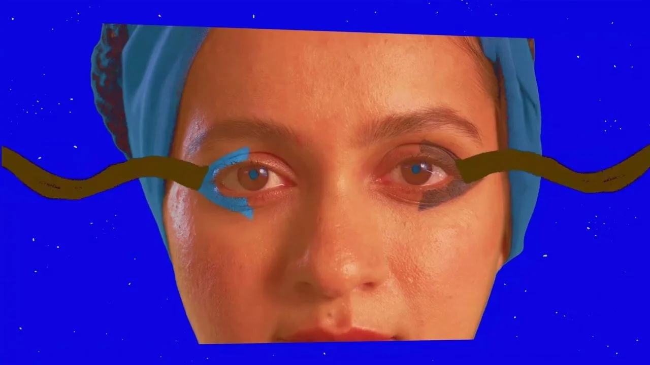 A surreal digital collage featuring a woman's face with abstract eyes and a starry blue background.