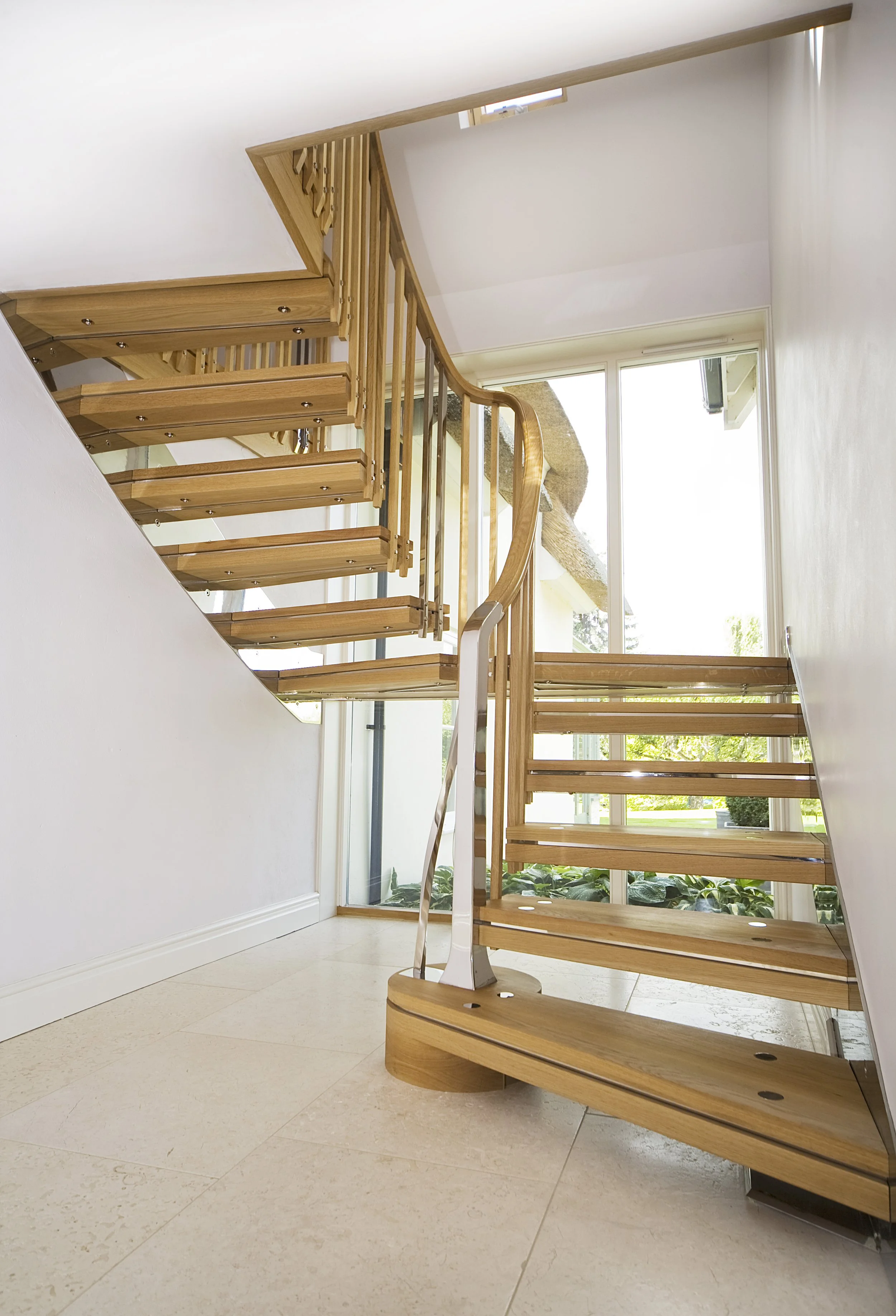 	
Bespoke oak and polished stainless steel cantilevered staircase in an historic cottage.