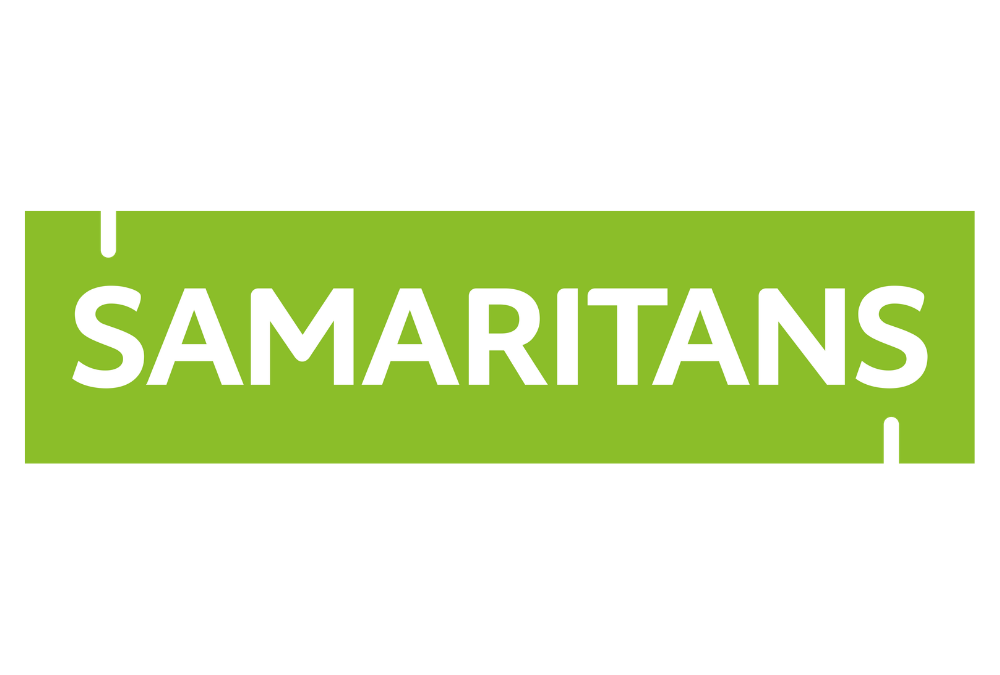 Green sign with the word 'SAMARITANS' in white capital letters.