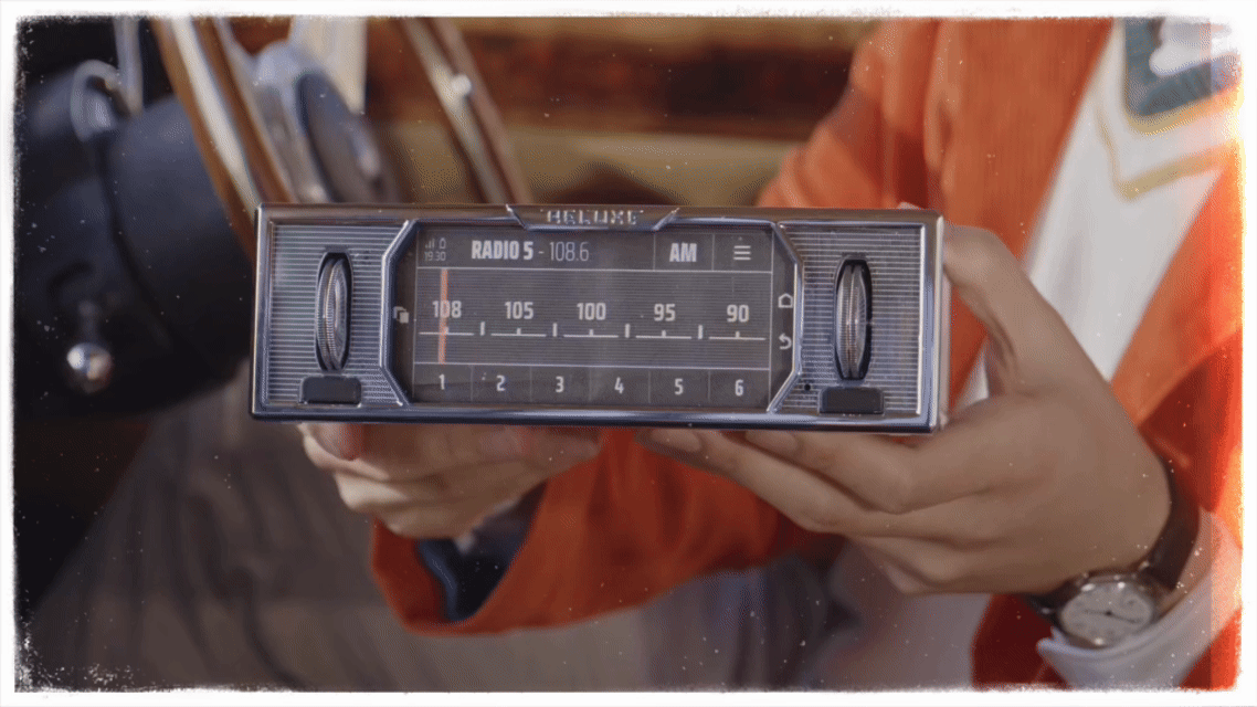 Reluxe Design founder Tom showing off the compact 1-din shallow body design of the Reluxe Stereo in his 1972 Bentley T1
