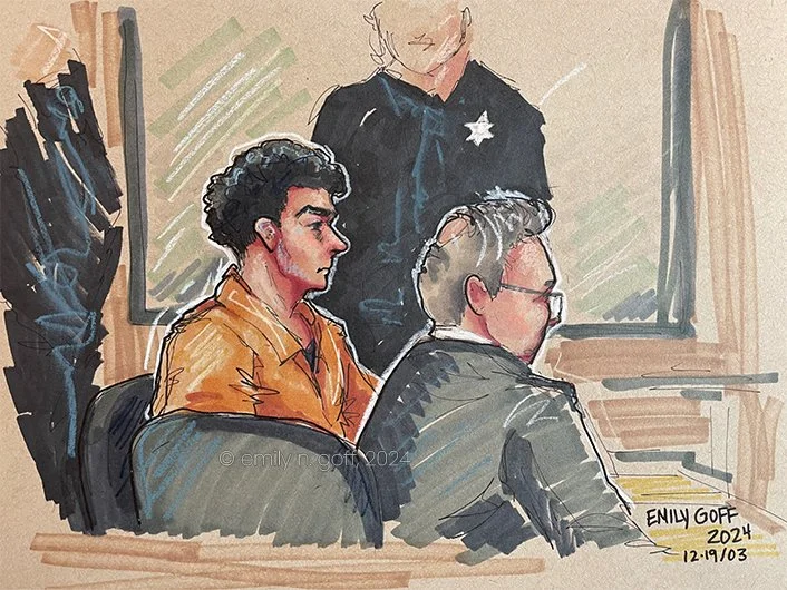 Luigi Mangione in an orange jumpsuit sitting at a table with his lawyer at his extradition hearing in Altoona PA, December 2024