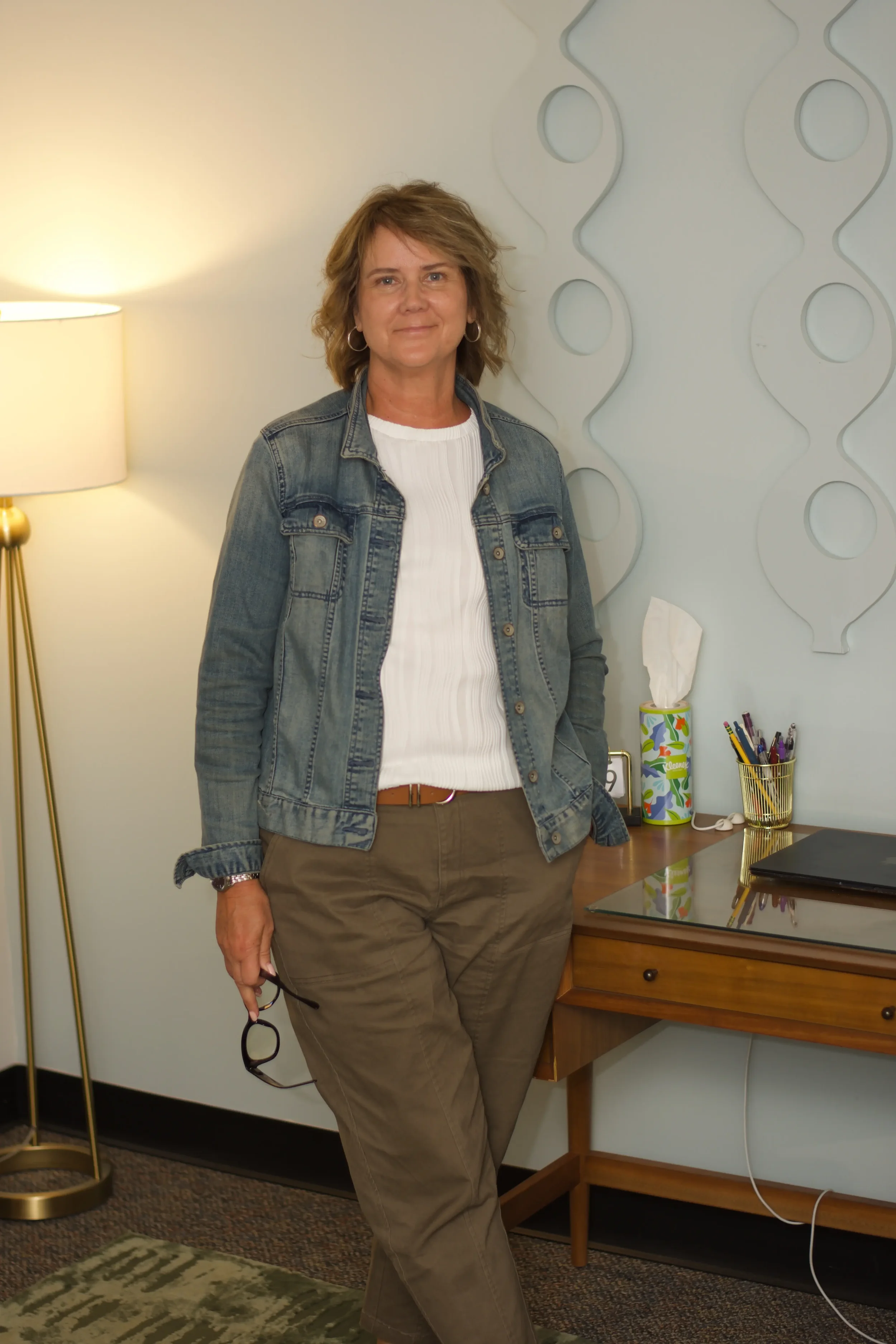 Kathie standing in her office