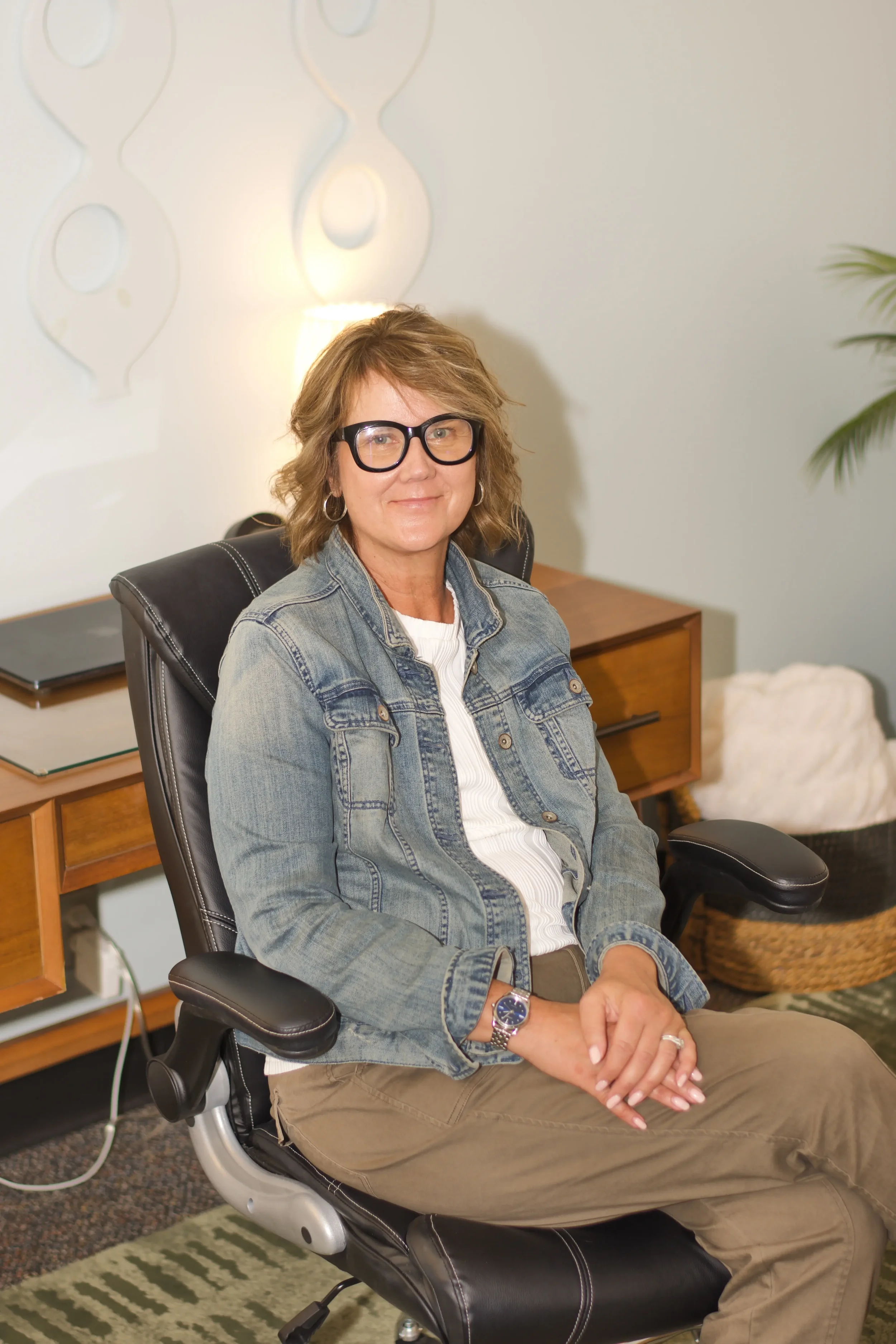 Kathie seated looking welcoming