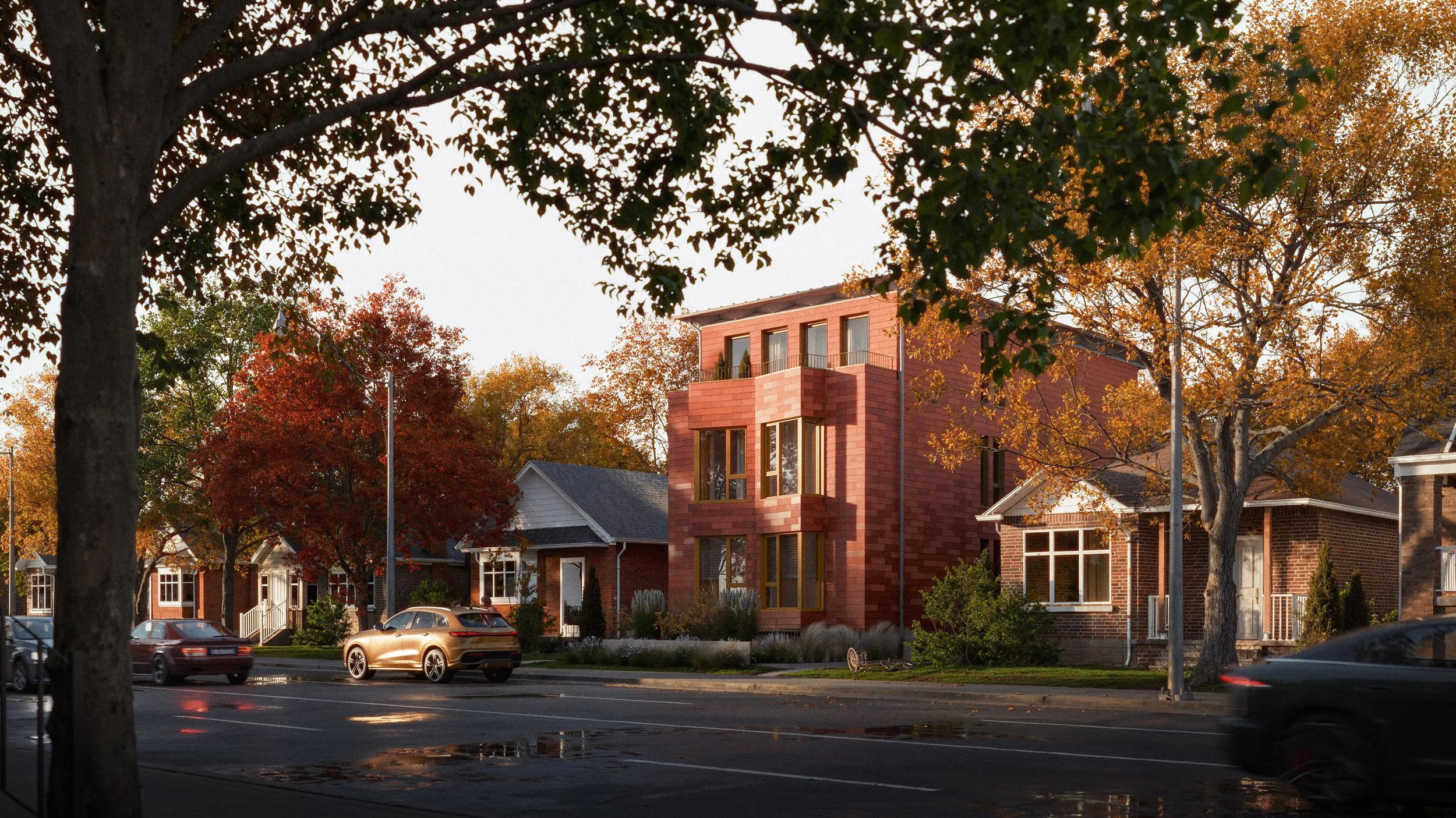 Street view with modern missing middle Home 05 building, trees with autumn foliage, parked cars, and wet pavement in the evening.