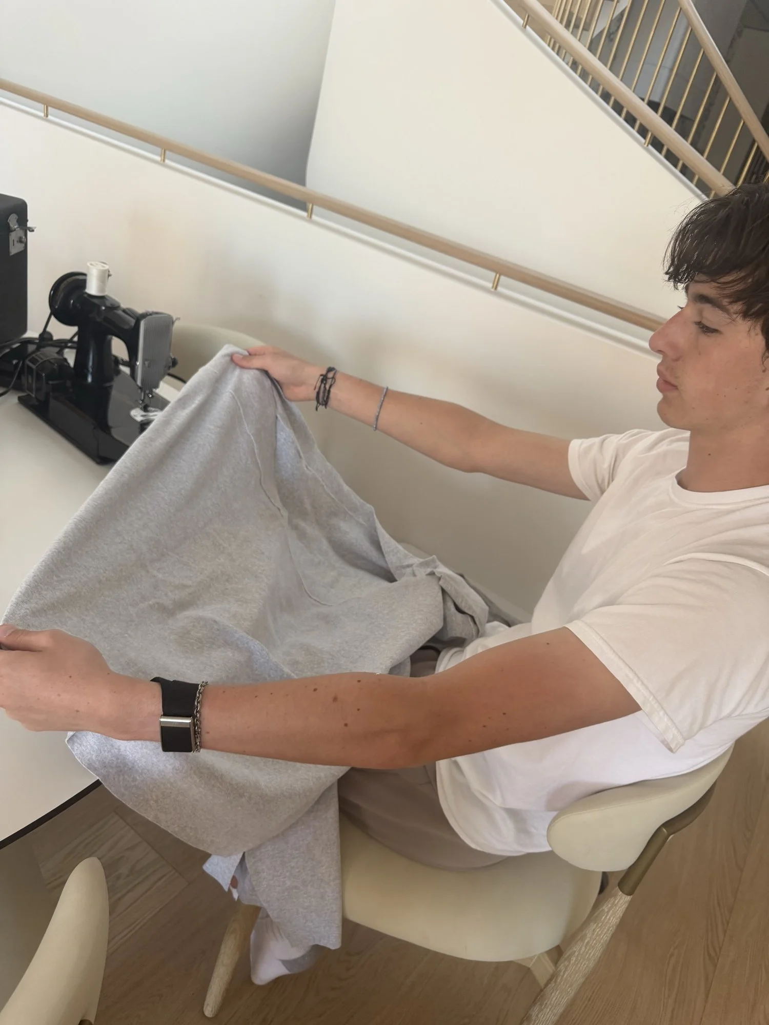 Brycen working with reclaimed fabric