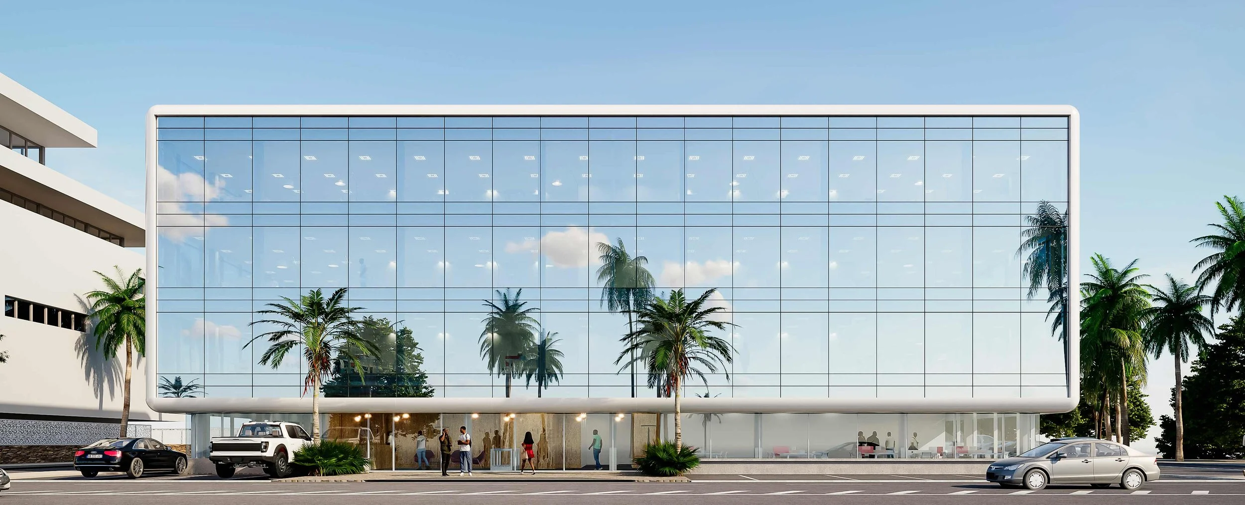 Un bâtiment moderne avec une façade en verre reflétant les palmier et le ciel, entouré de voitures et de personnes à l'entrée.